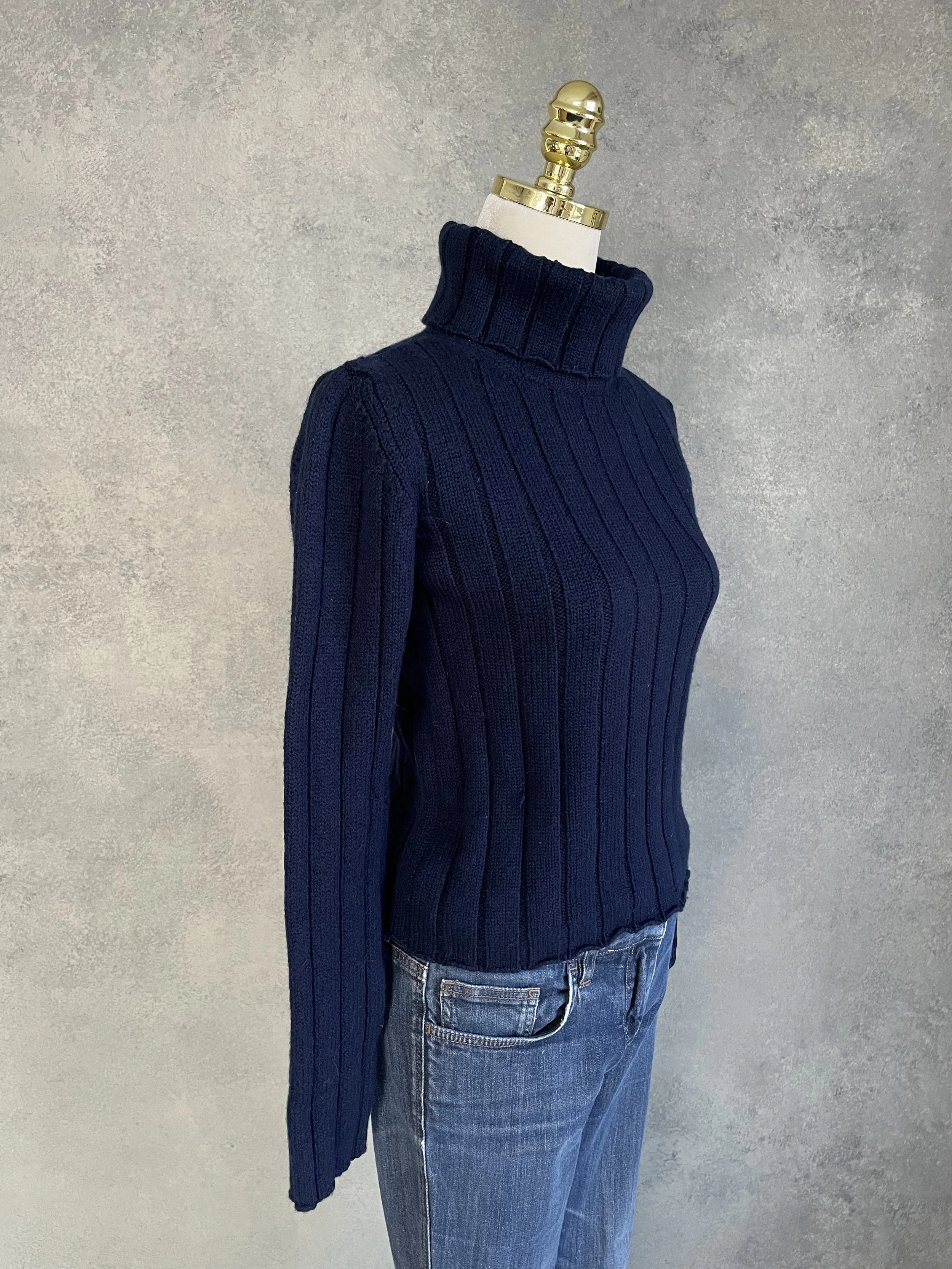 Side profile of the Hugo Boss navy wool turtleneck, illustrating the comfortable, tailored cut
