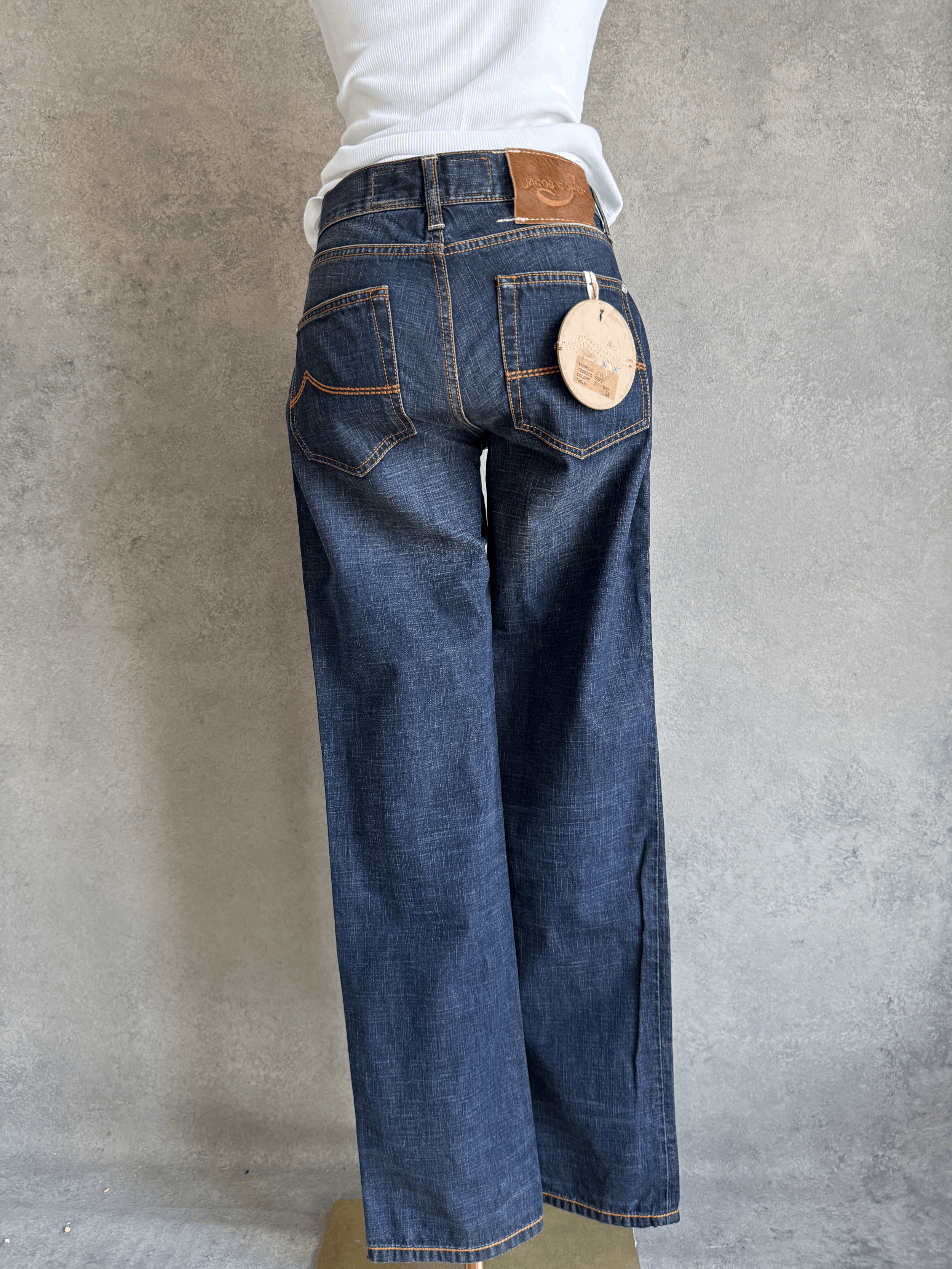 View of the mannequin wearing the Jacob Cohën jeans, emphasizing the structured, rare Japanese denim quality.