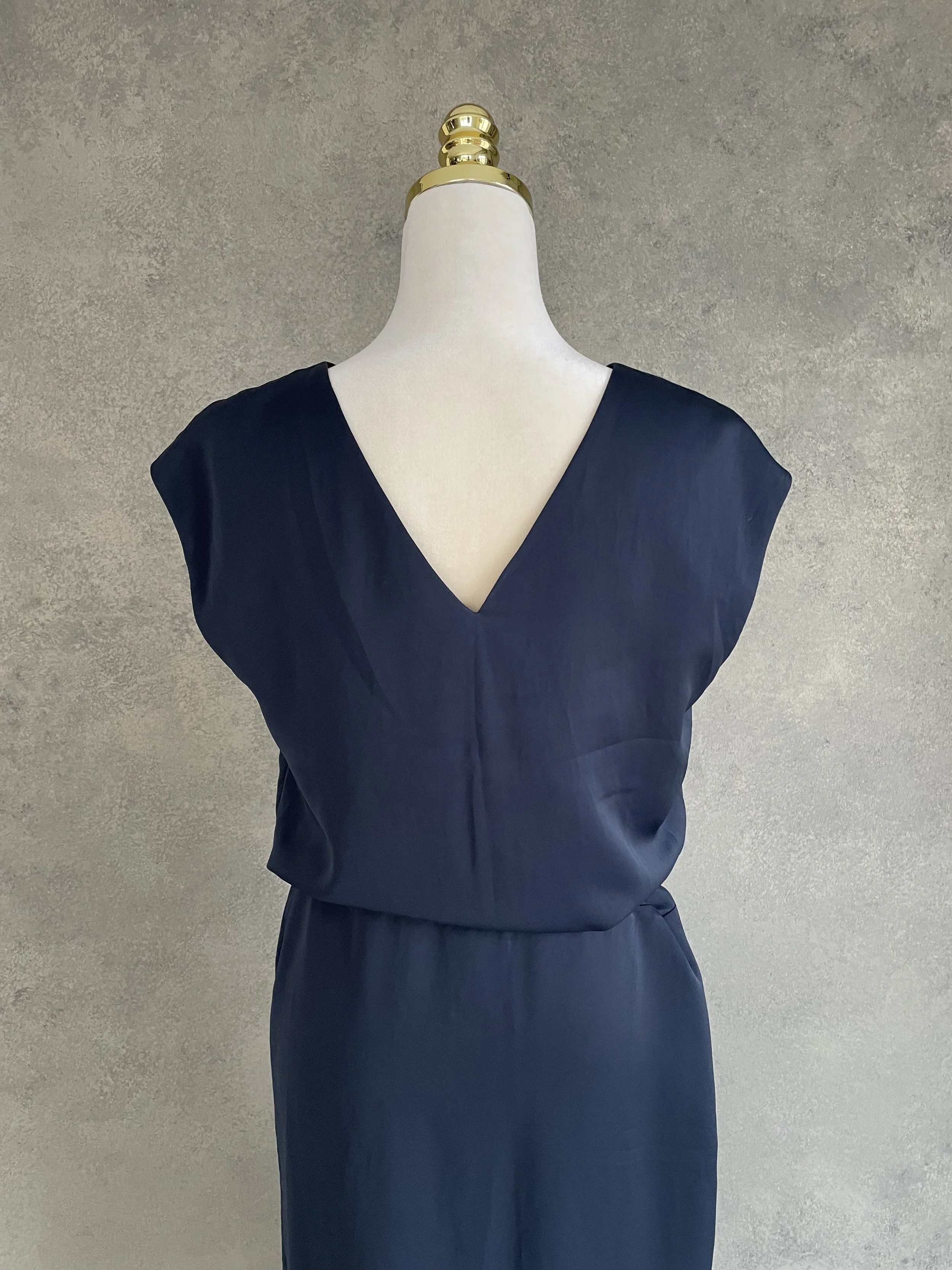 Back view focusing on the upper bodice and V-neckline.