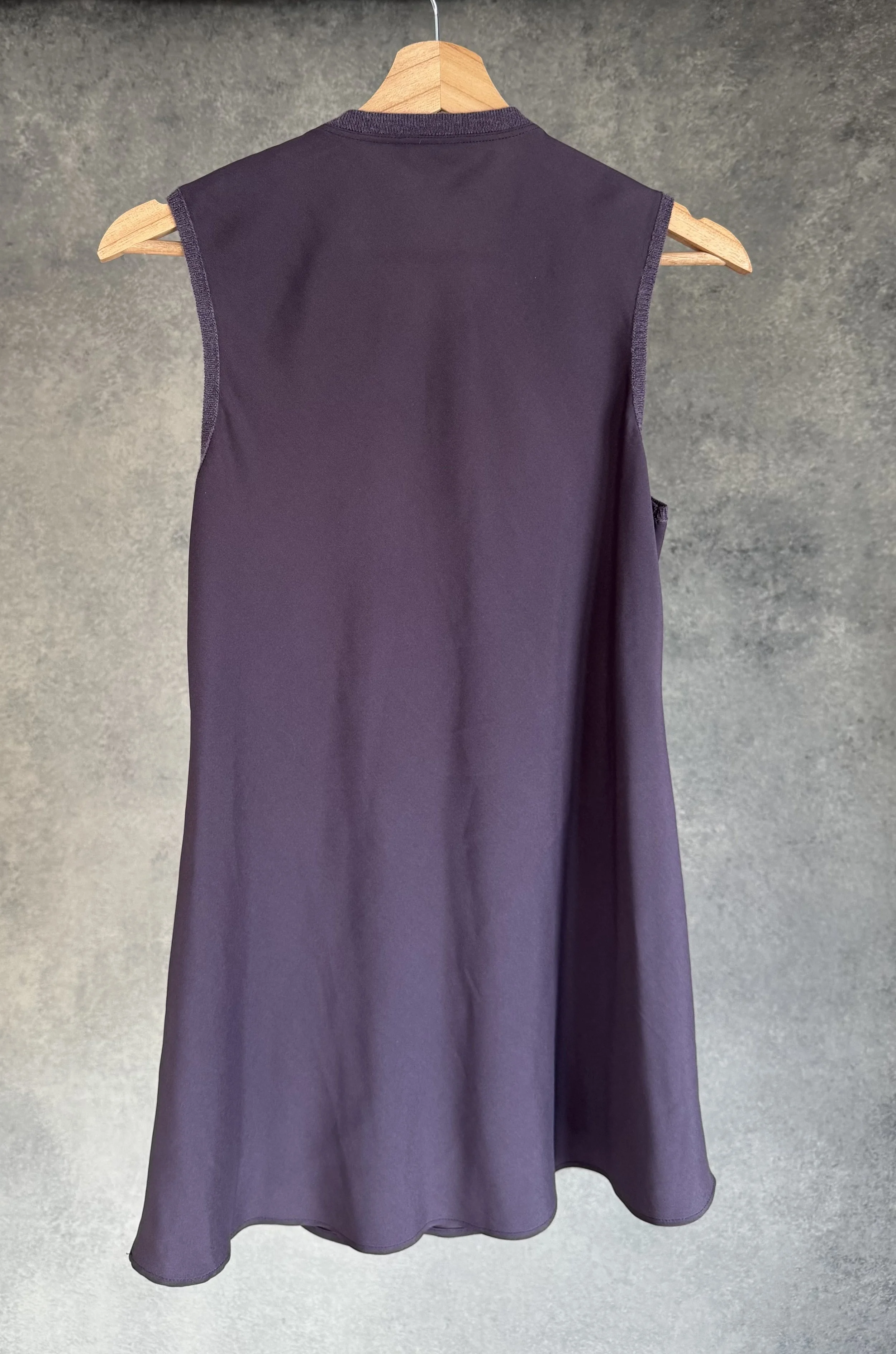 Full back view of the Brunello Cucinelli mauve tunic, emphasizing the clean lines and premium fabric drape