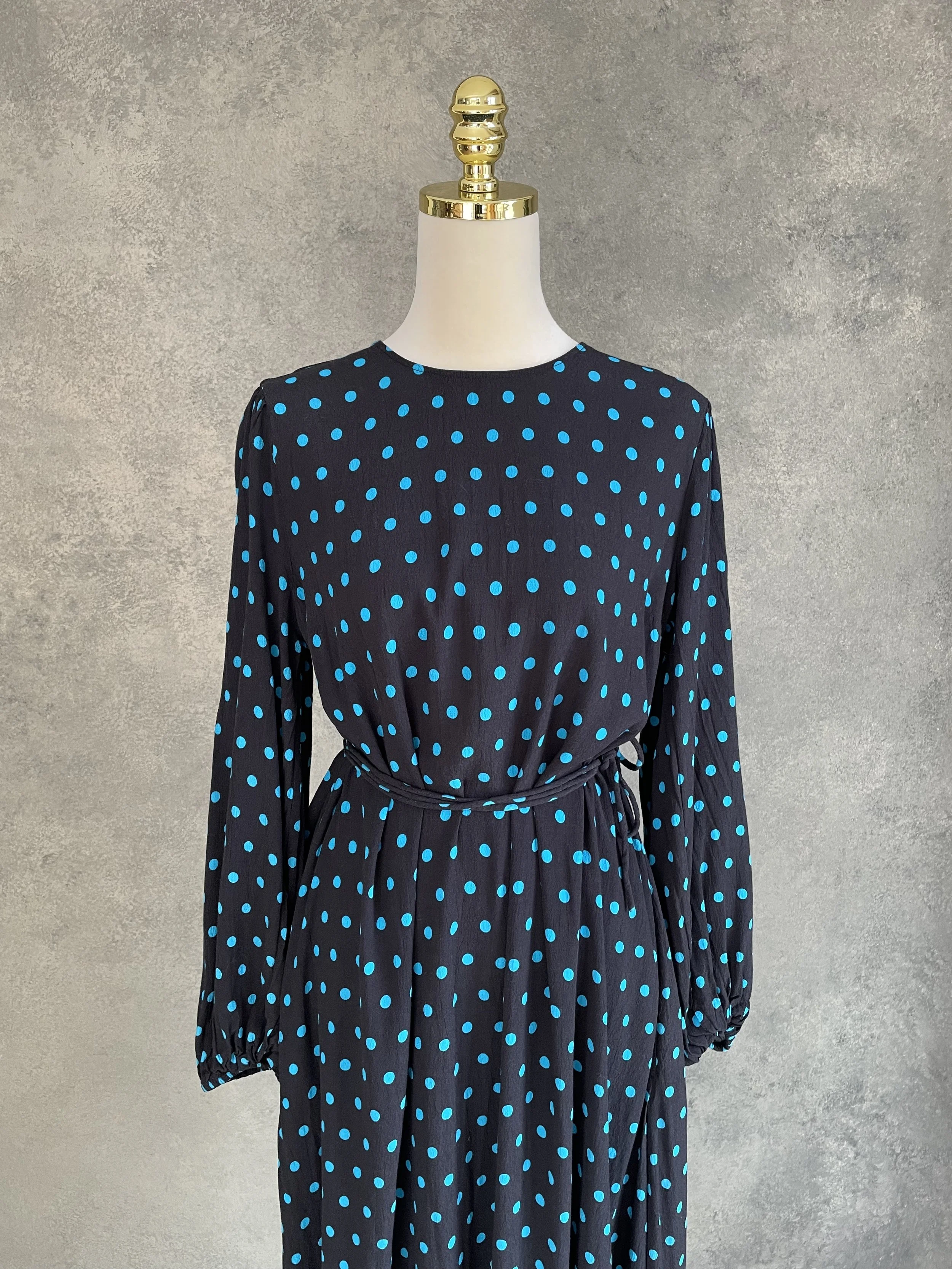 Close-up front view of the Essentiel Antwerp dress, highlighting the round neckline and pattern.