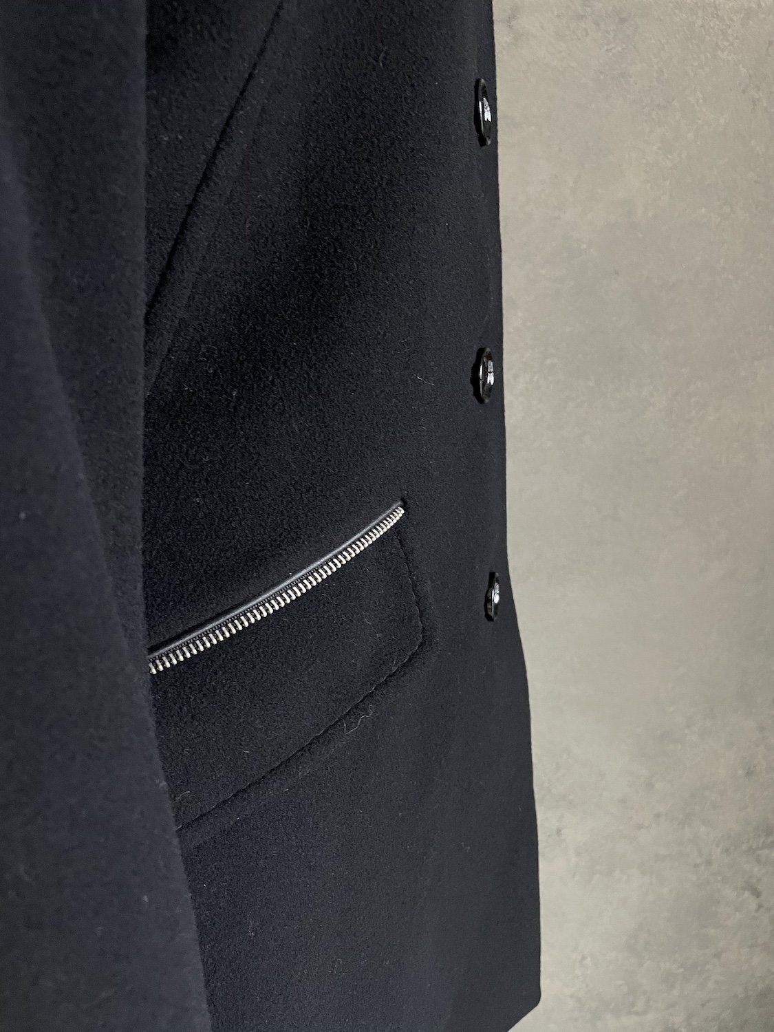 Scapa black coat pocket detail with silver zipper trim