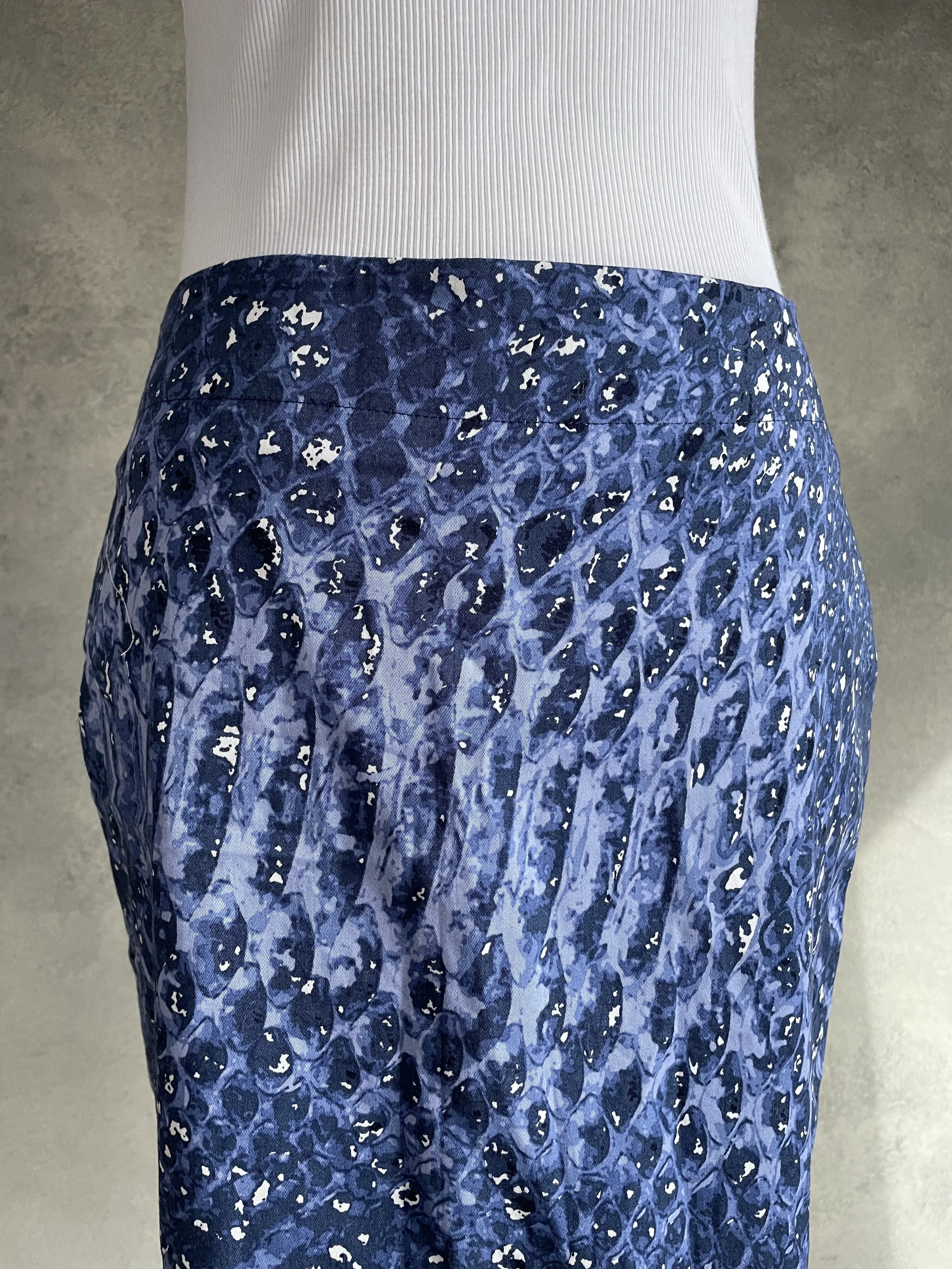 Close-up of the Gigue skirt waist detailing and blue multi-color print