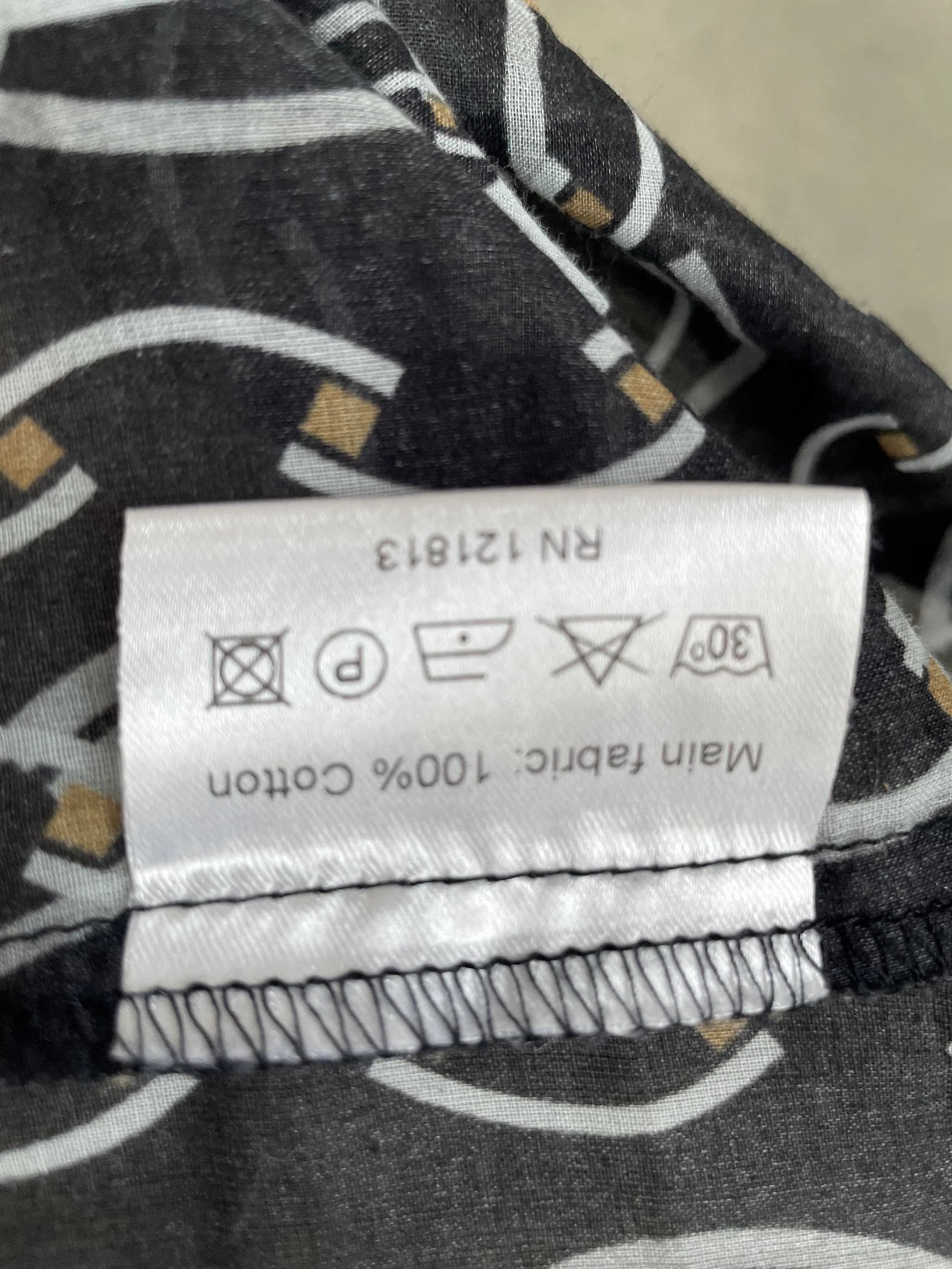 Care instructions tag indicating "Main fabric: 100% Cotton".