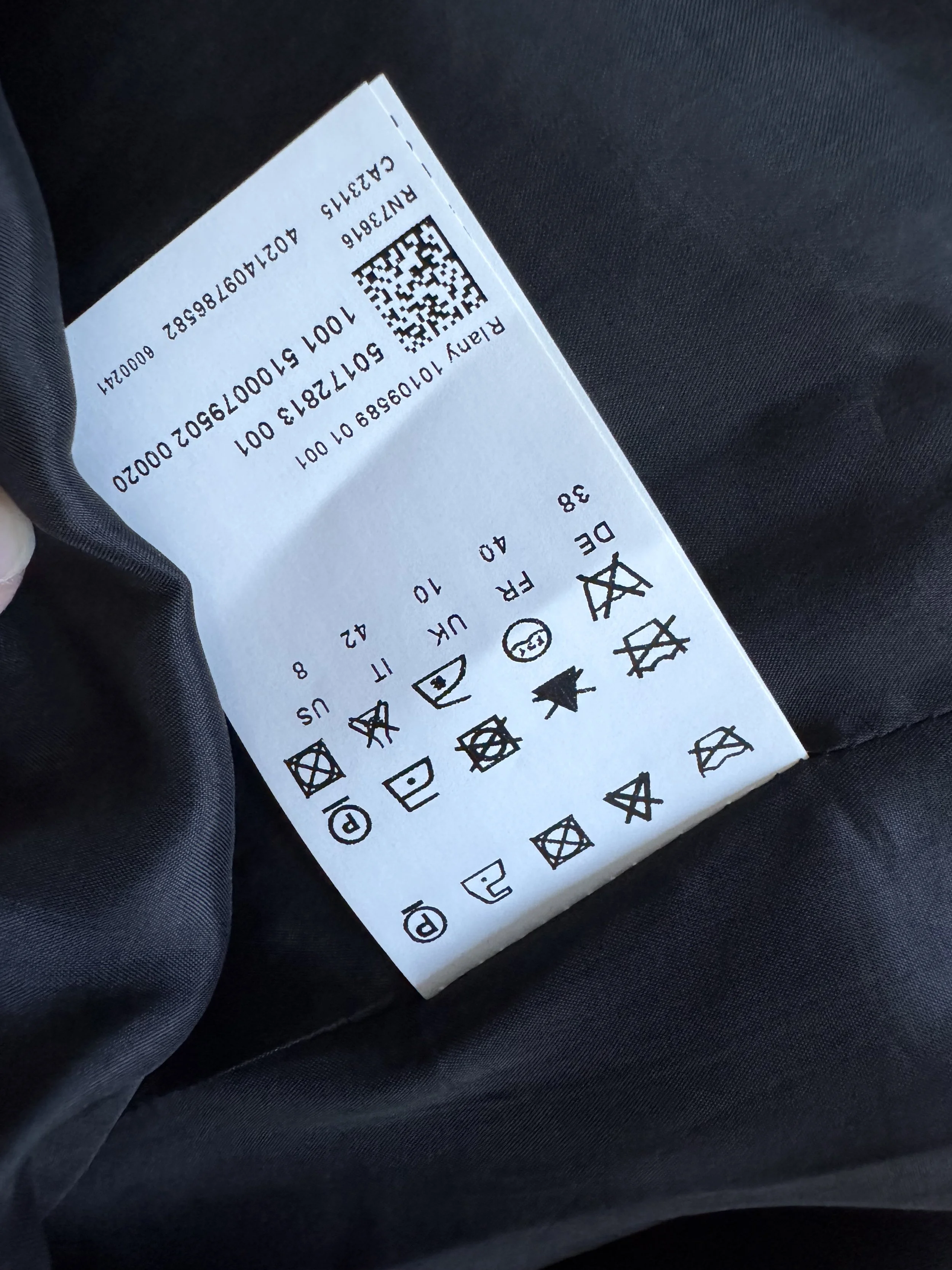 Close-up of the interior care and size tag showing EU size 38.