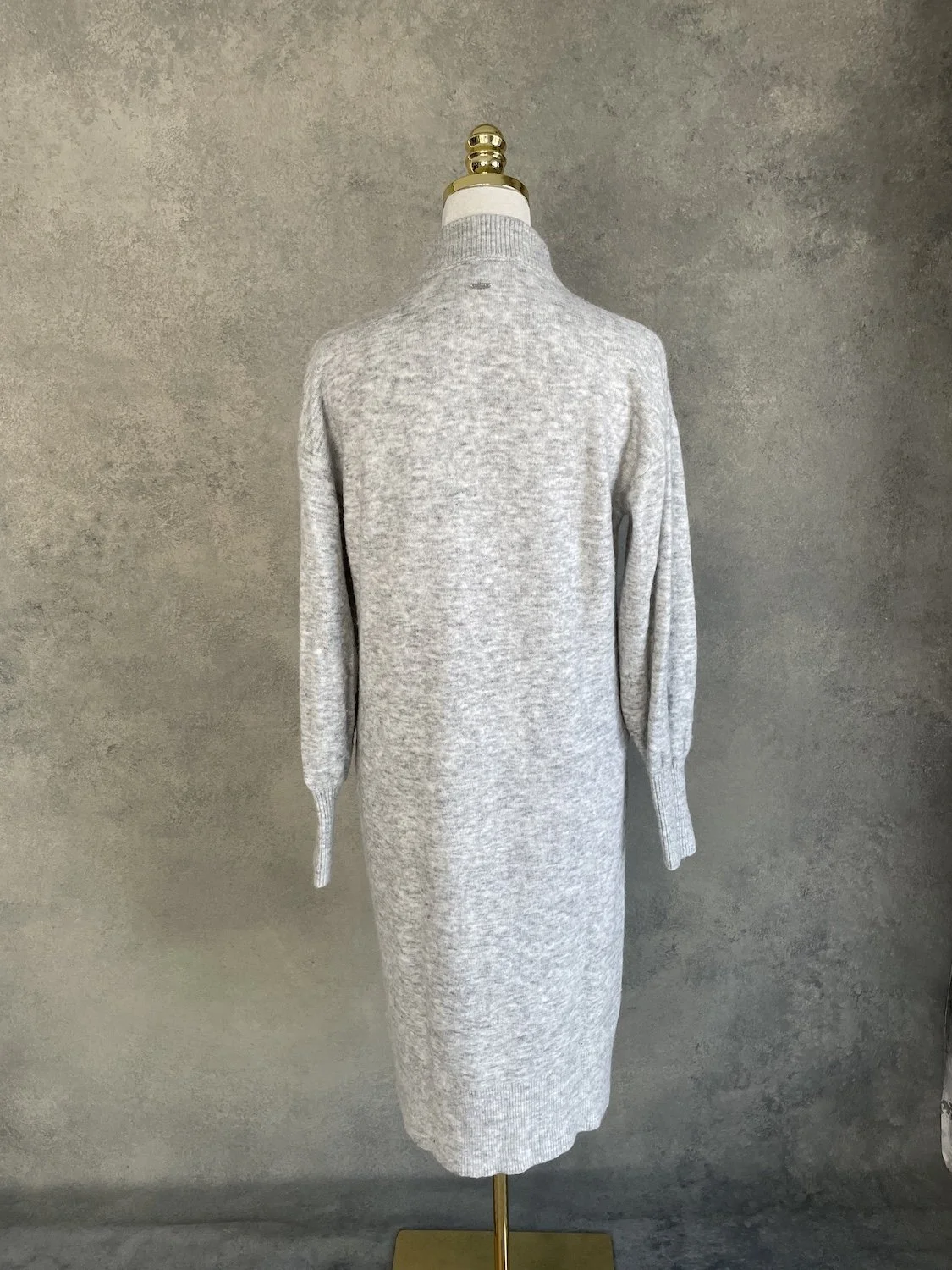Xandres knit midi dress back view on mannequin