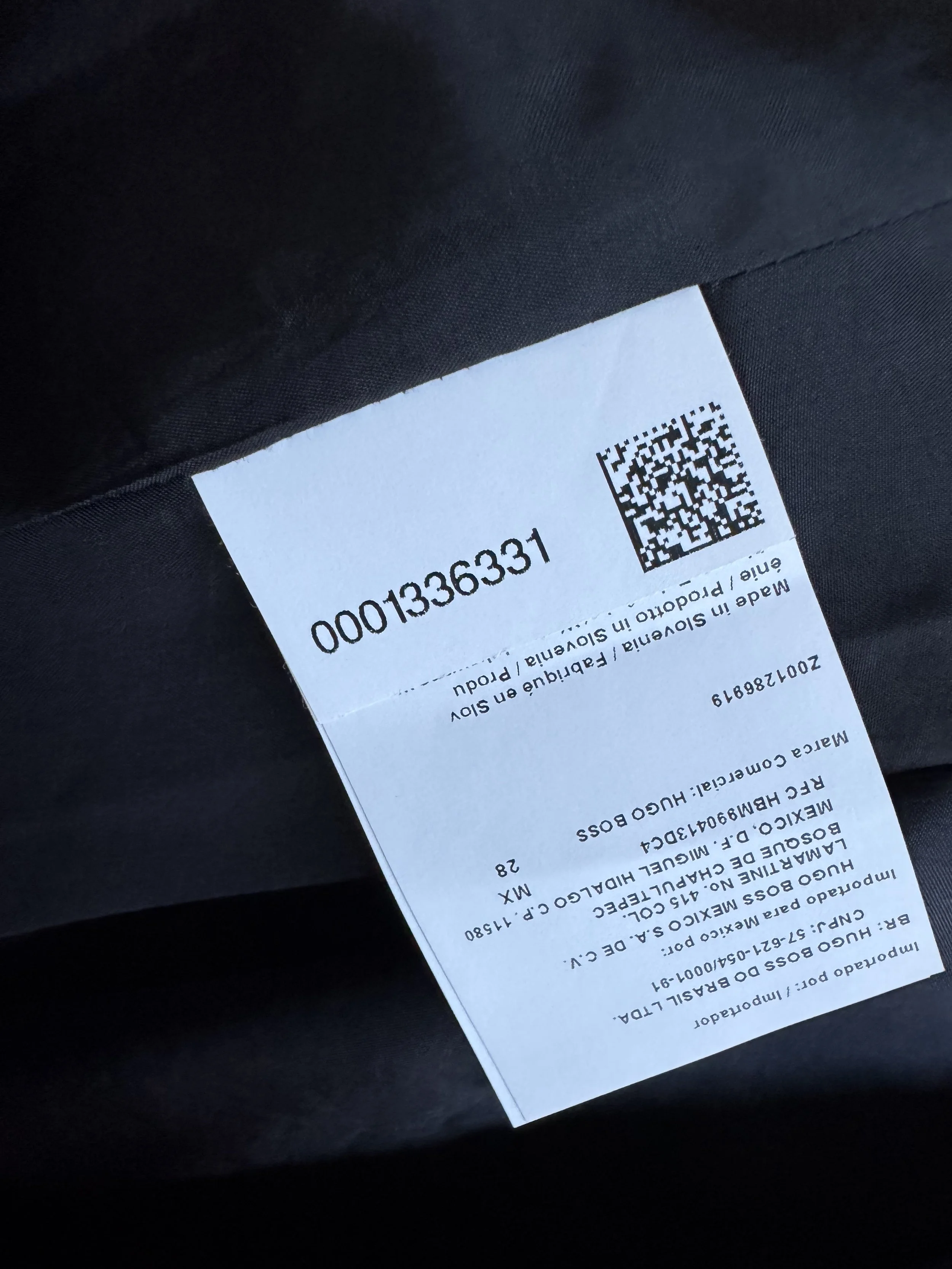 Close-up of the interior manufacturing tag indicating 'Made in Slovenia'