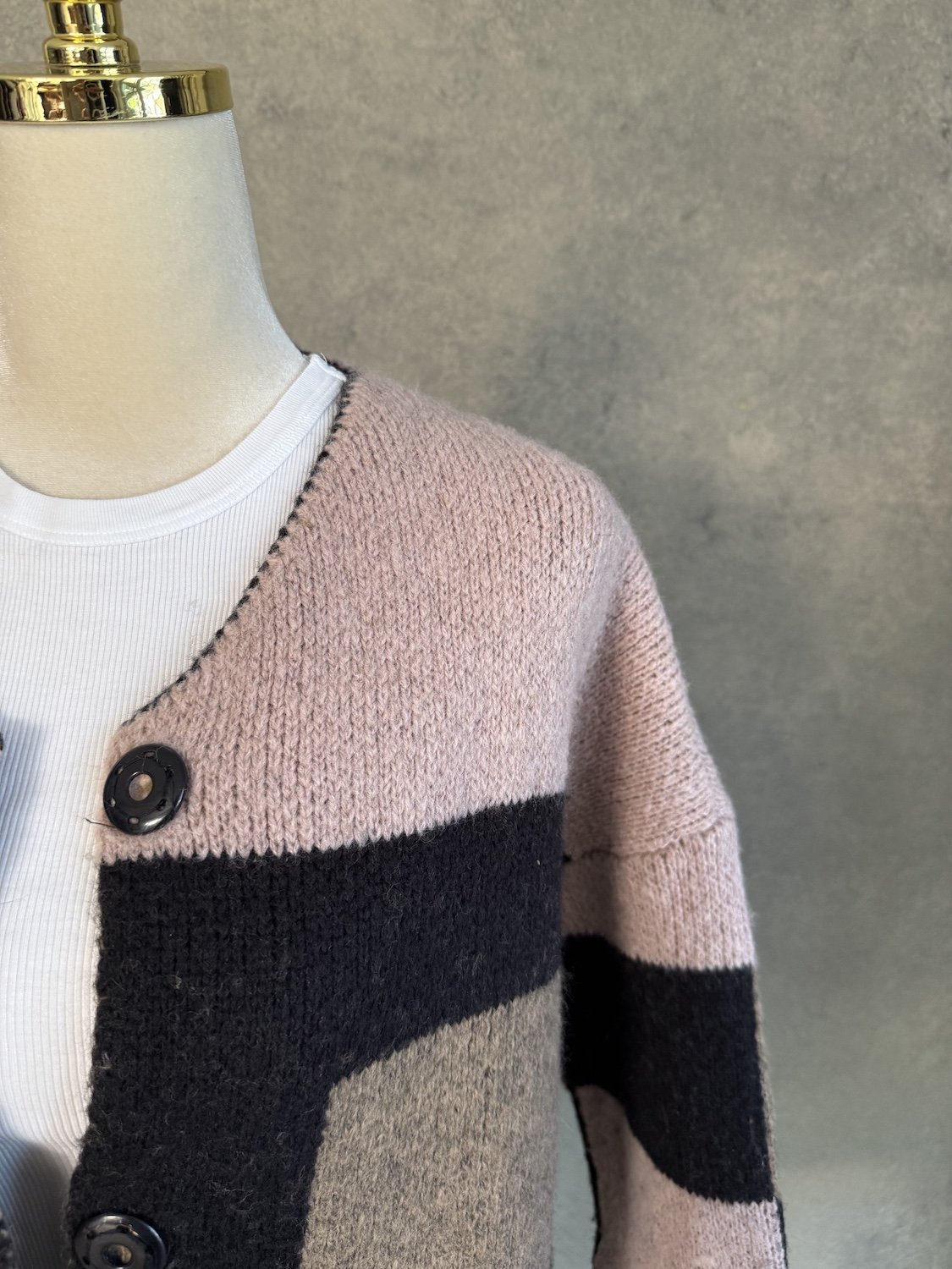 Close-up of pink and black knit texture on La Fée Maraboutee cardigan