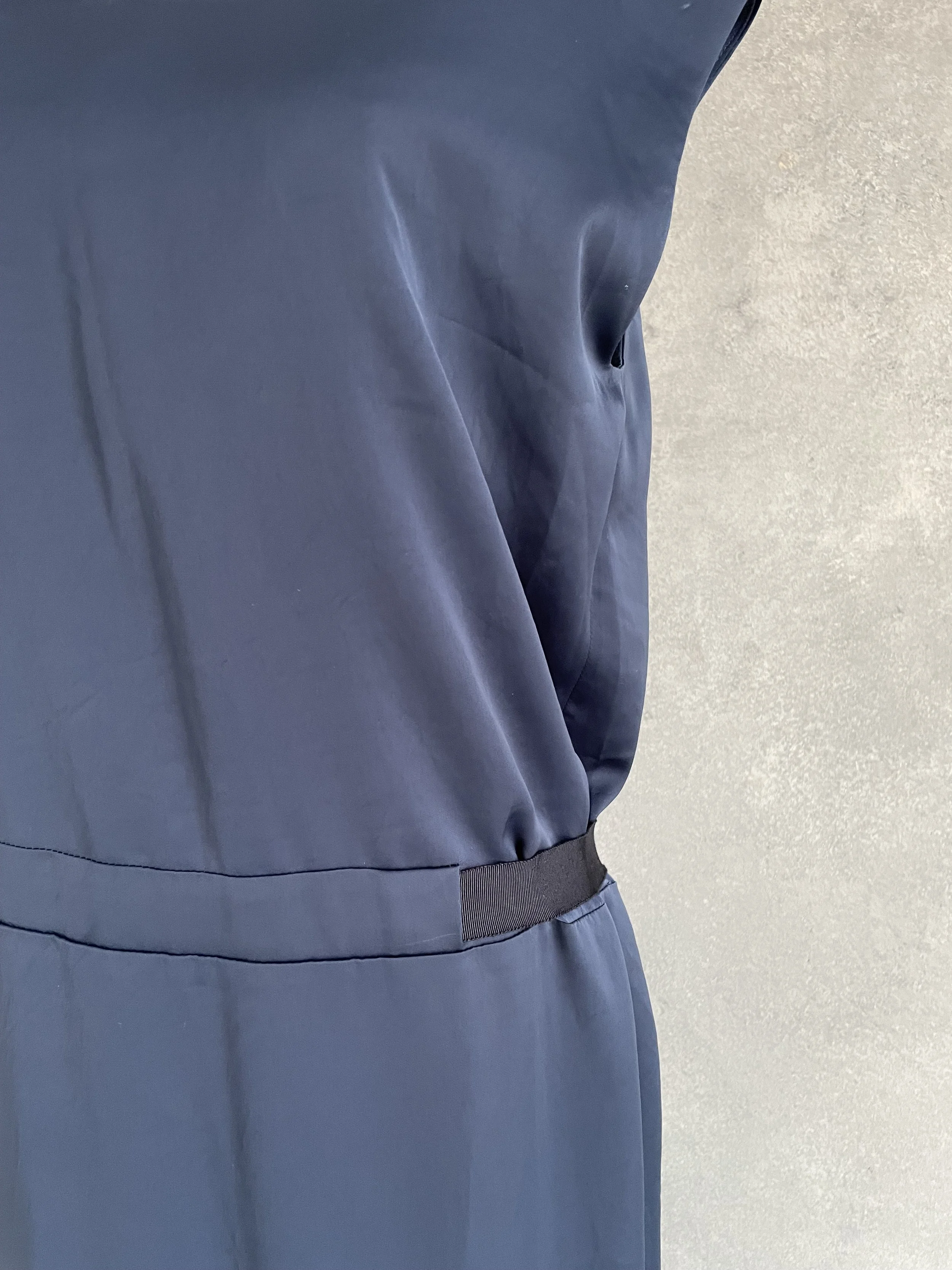 Close-up showing the waist and tie detail of the deep blue Rue Blanche maxi dress.