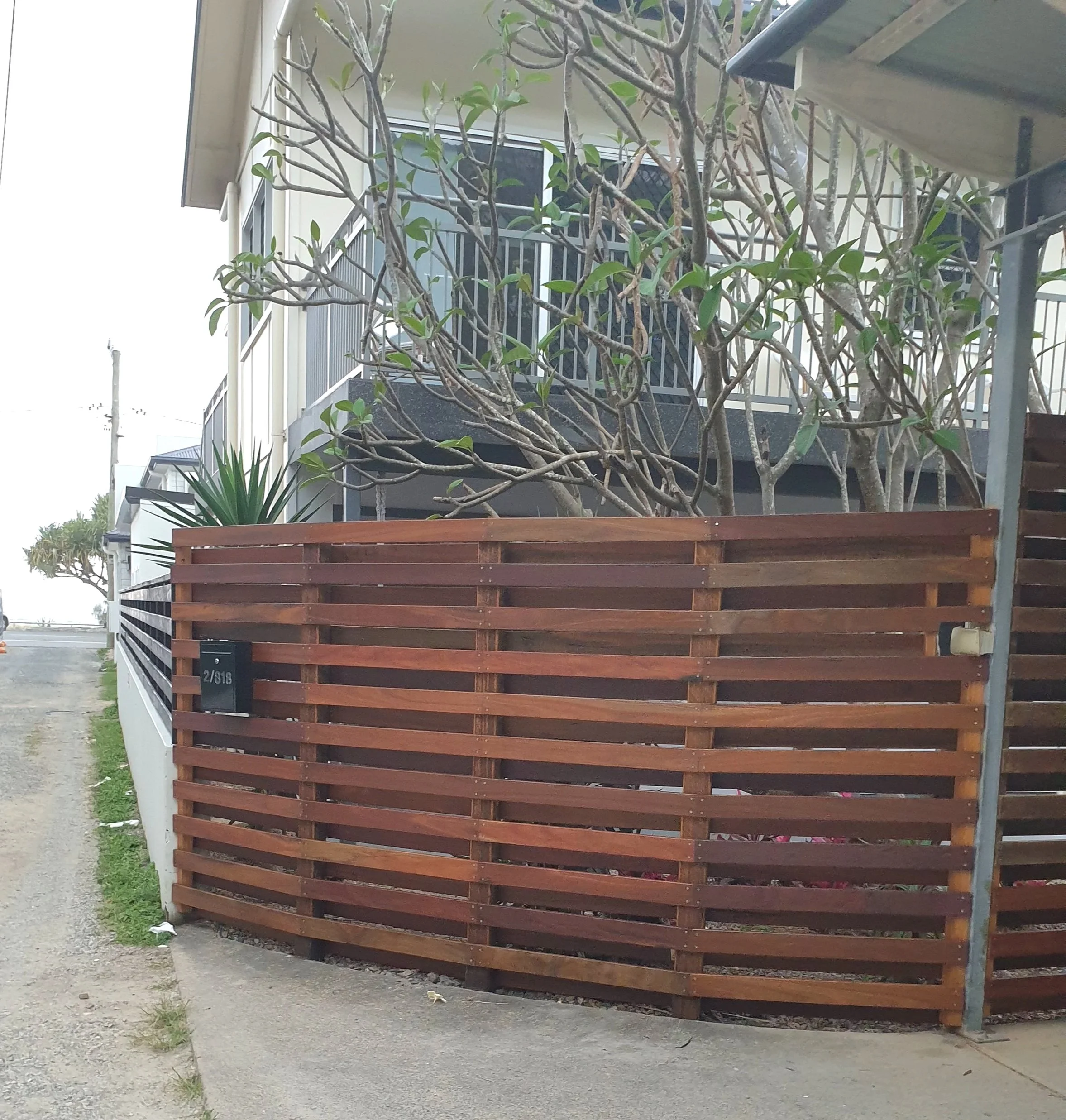 Merbau timber fence, street.