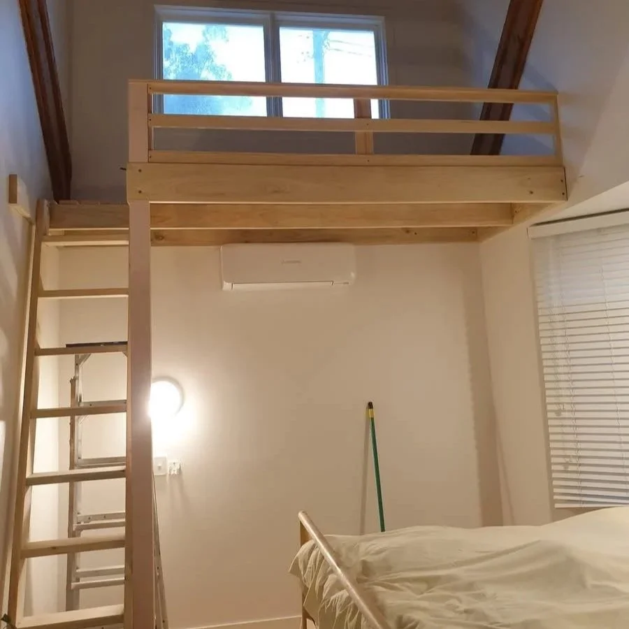 Loft with stairs and small balcony, balustrade, bedroom.
