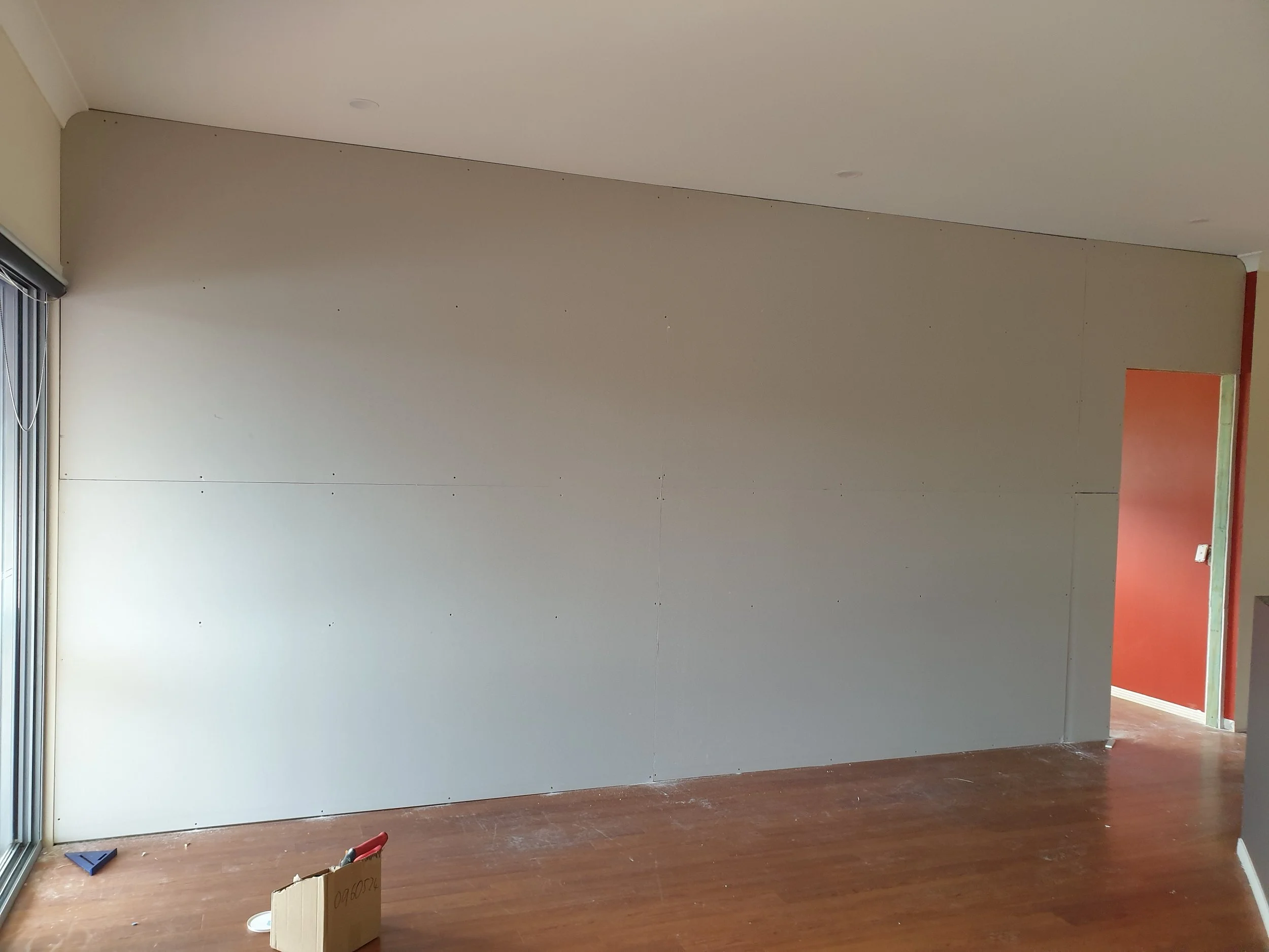 Internal finished plasterboard repairs, large wall.