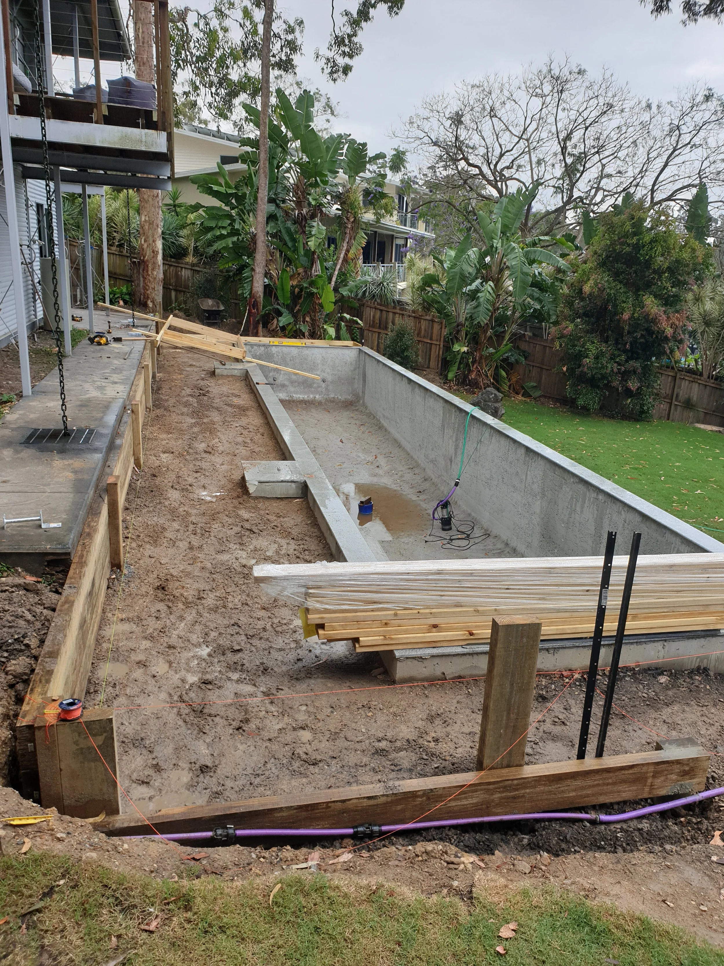 swimming pool cavity, land preparation for deck.