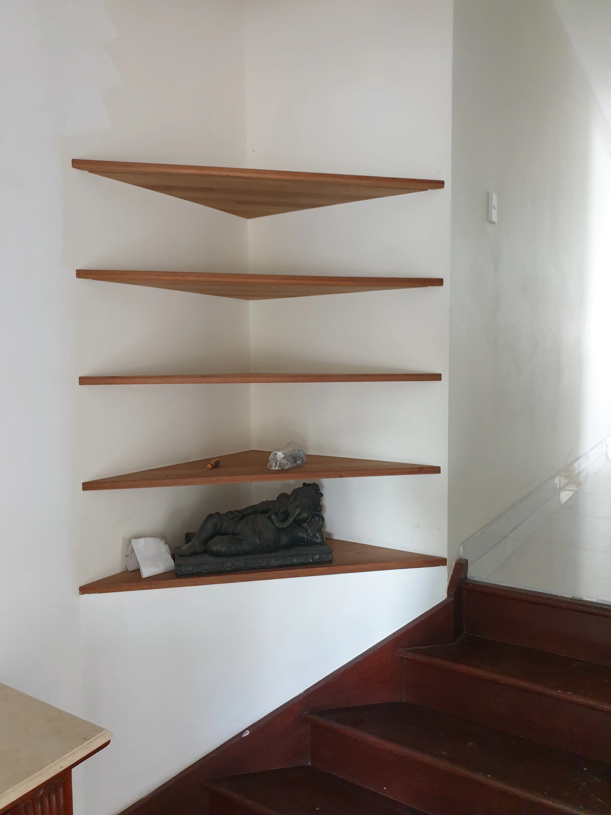 five timber corner shelves. 