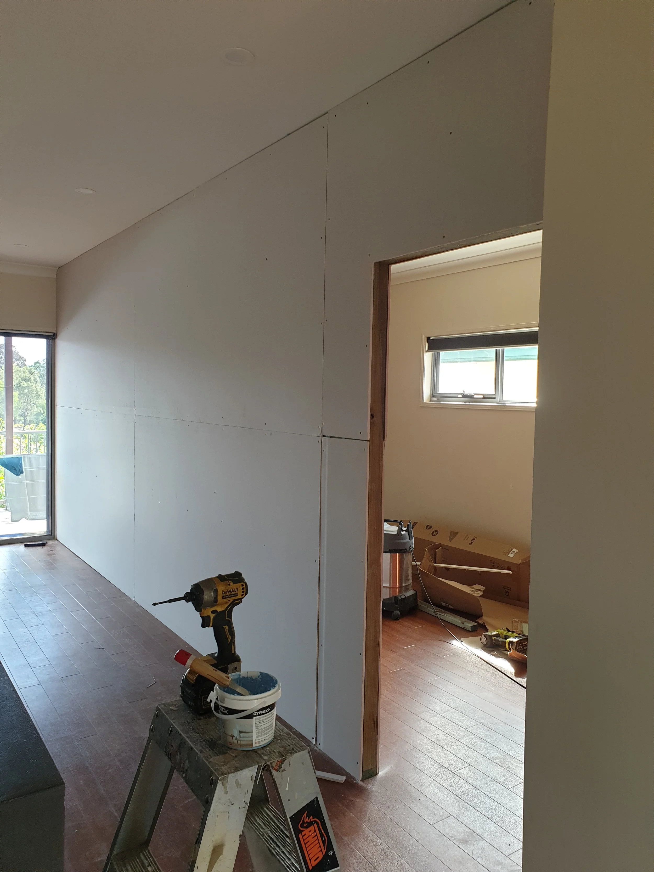 Internal plasterboard replacement, large wall.