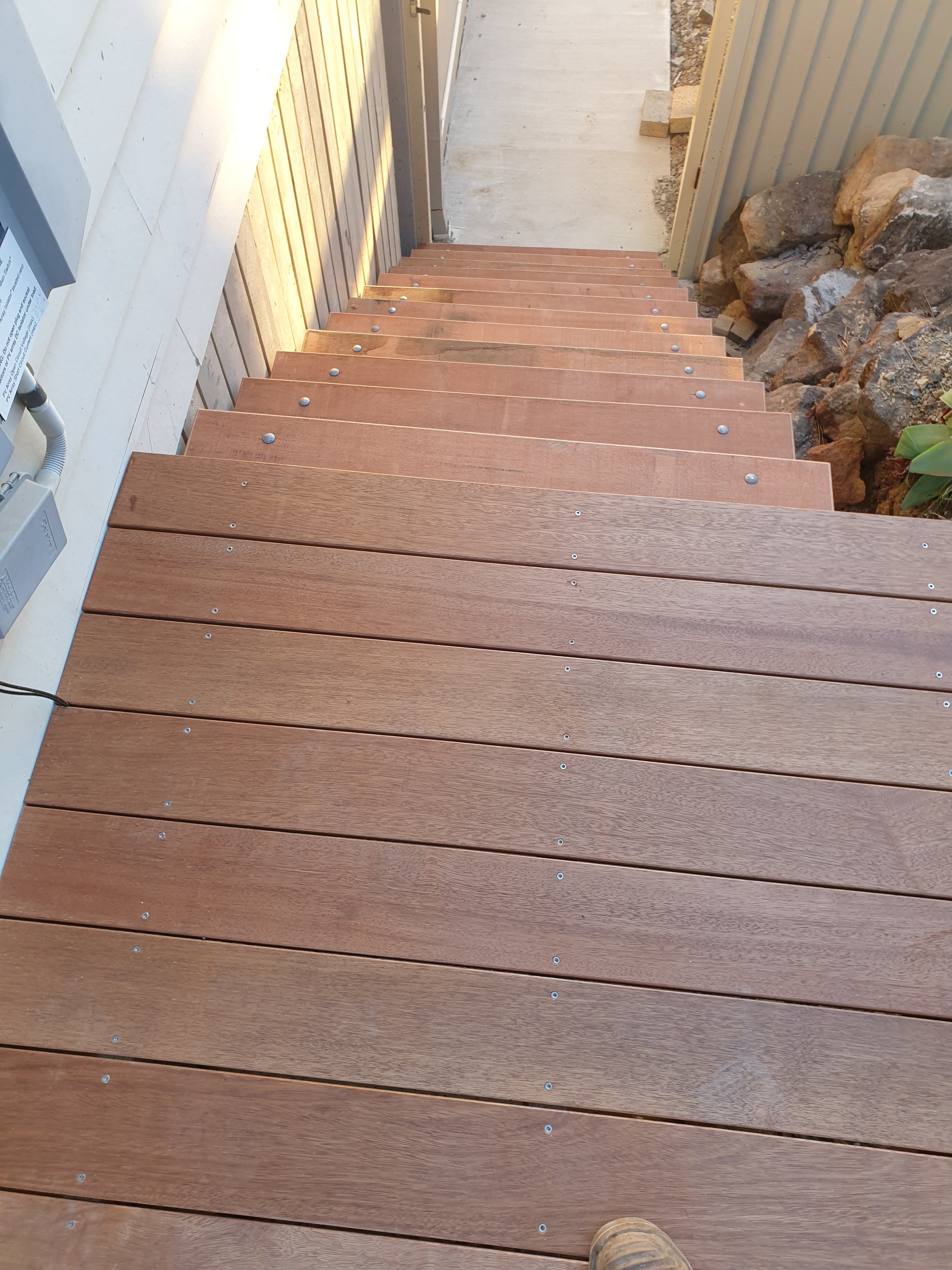 External timber stairs. Stained wood.