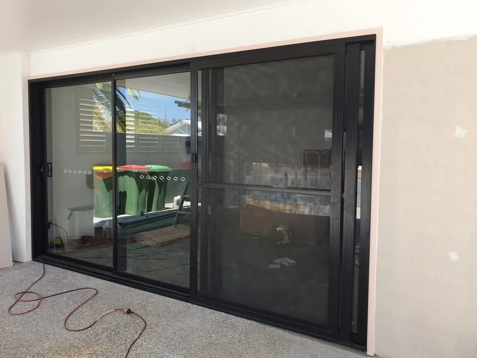 Large black glass sliding doors 