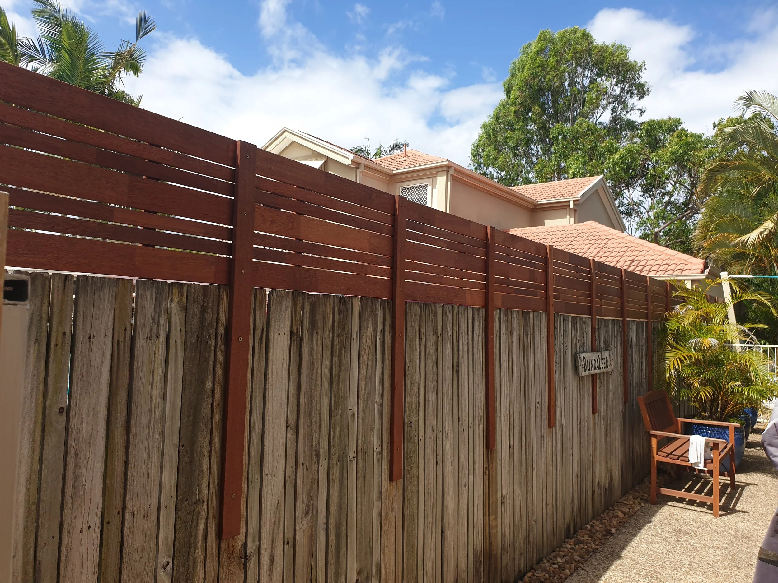 wooden fence with timber privacy screen.