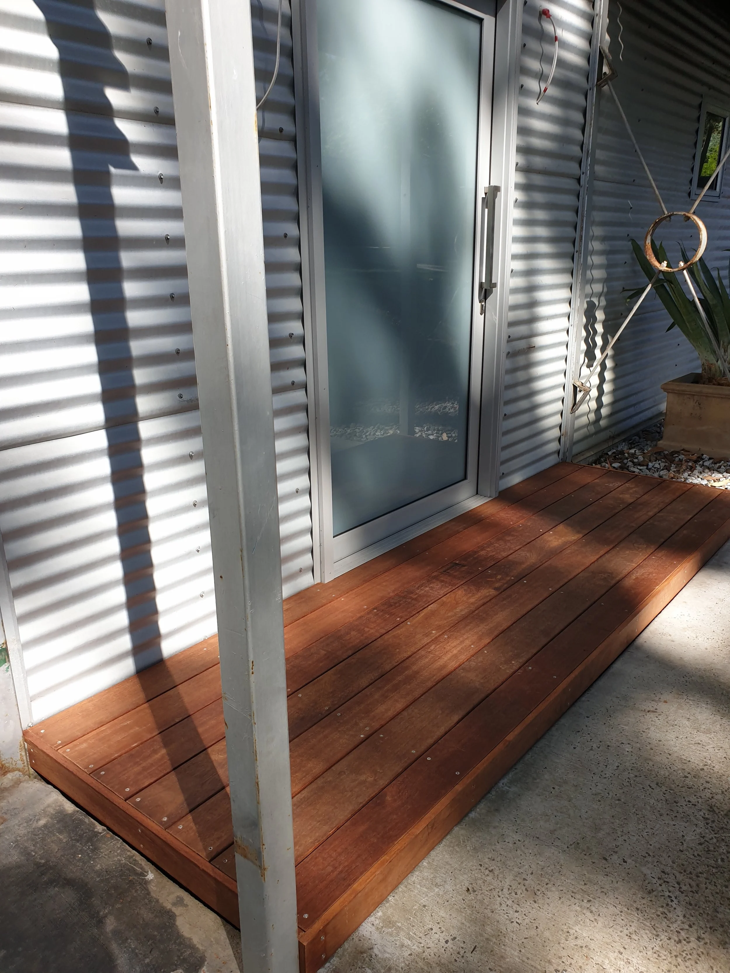 entrance to house, wooden, timber step and back door.