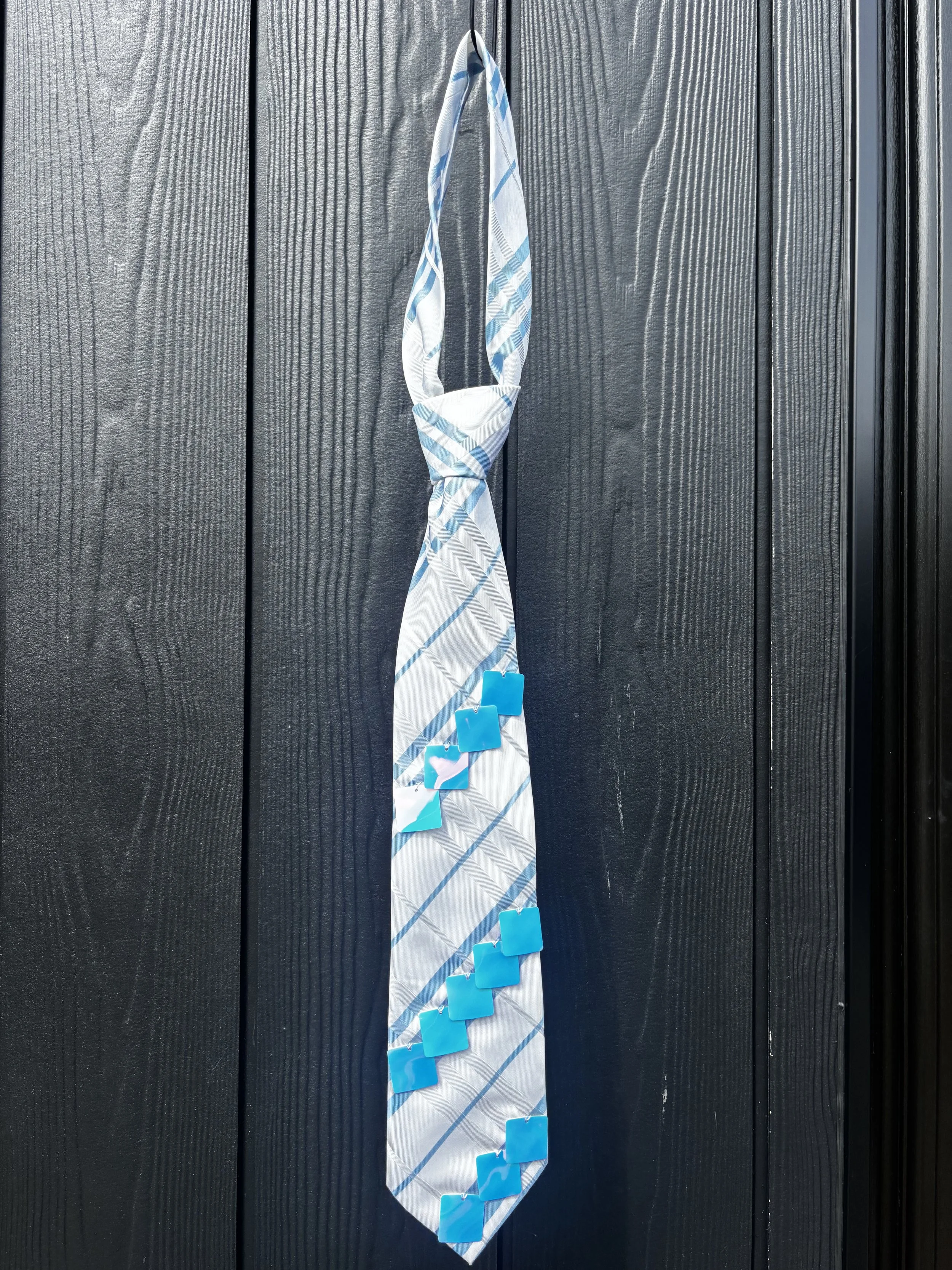 Blue and white plaid pattern tie with sequins detail.