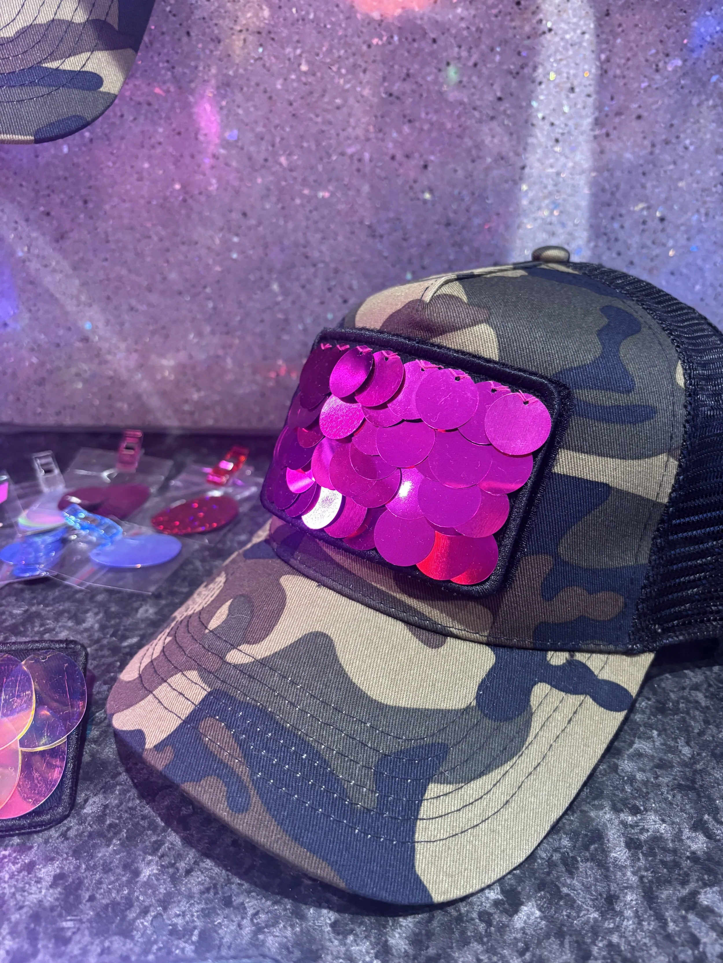 Camouflage cap with interchangeable sequin patches.