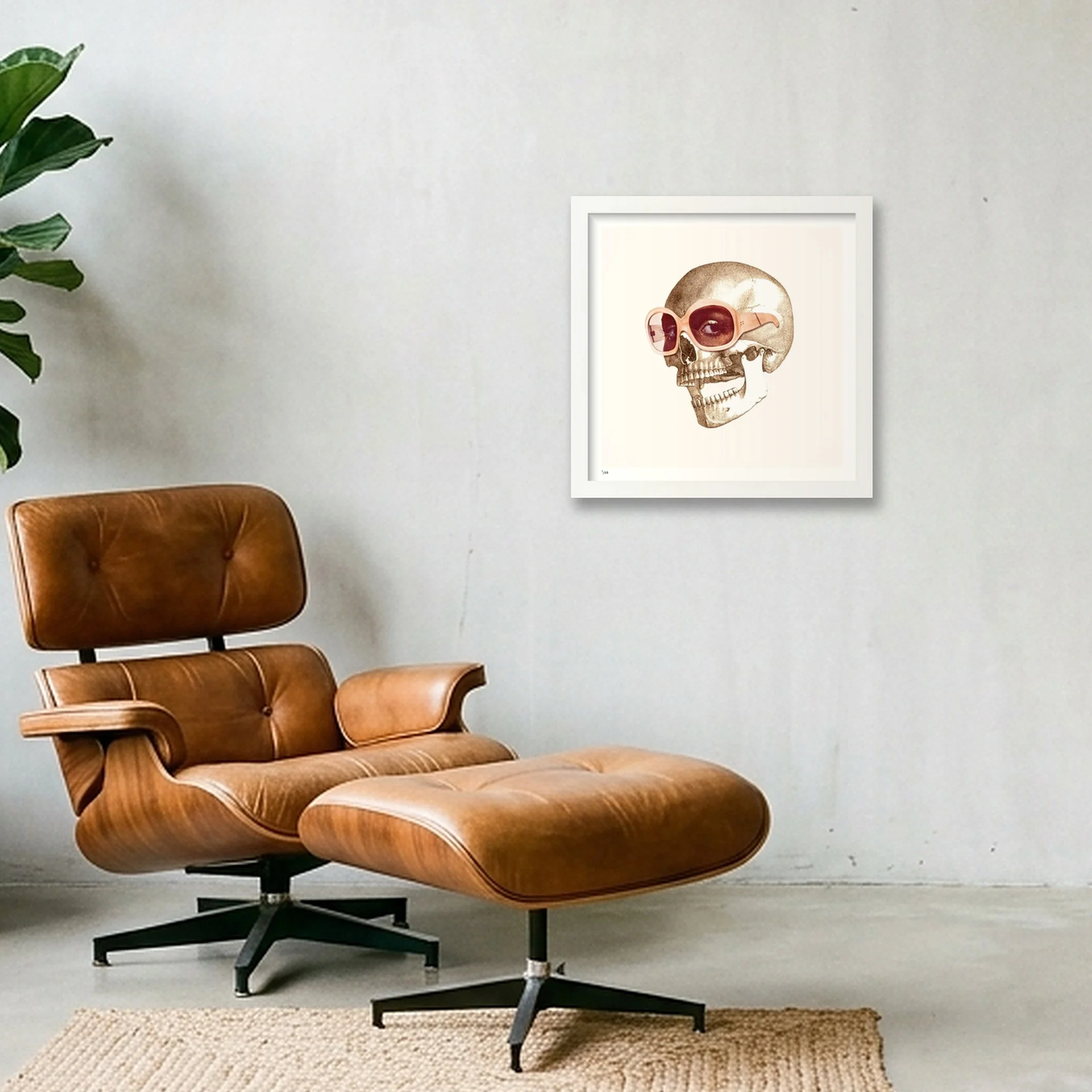 Eye Candy surreal collage print in a white frame, displayed in a modern living room above a leather chair.