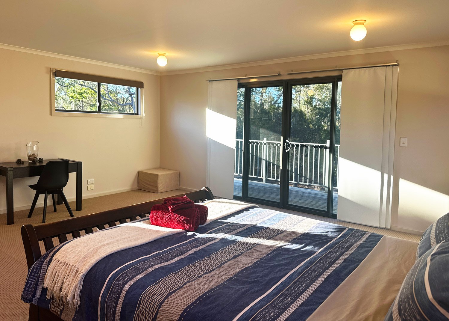 The upstairs bedroom is very spacious and gives you a view of the Eucalypt canopy. 