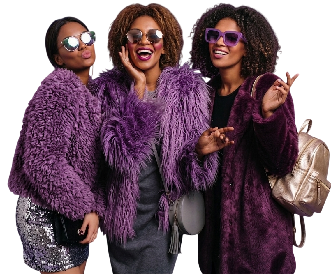 Three women in colorful fur coats and large sunglasses smiling and posing together.