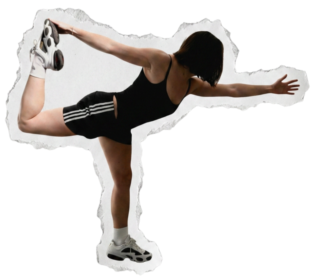 Woman in black sportswear performing a standing twist exercise, balancing on one leg and holding the other foot behind her back with one hand, stretching her arm forward.