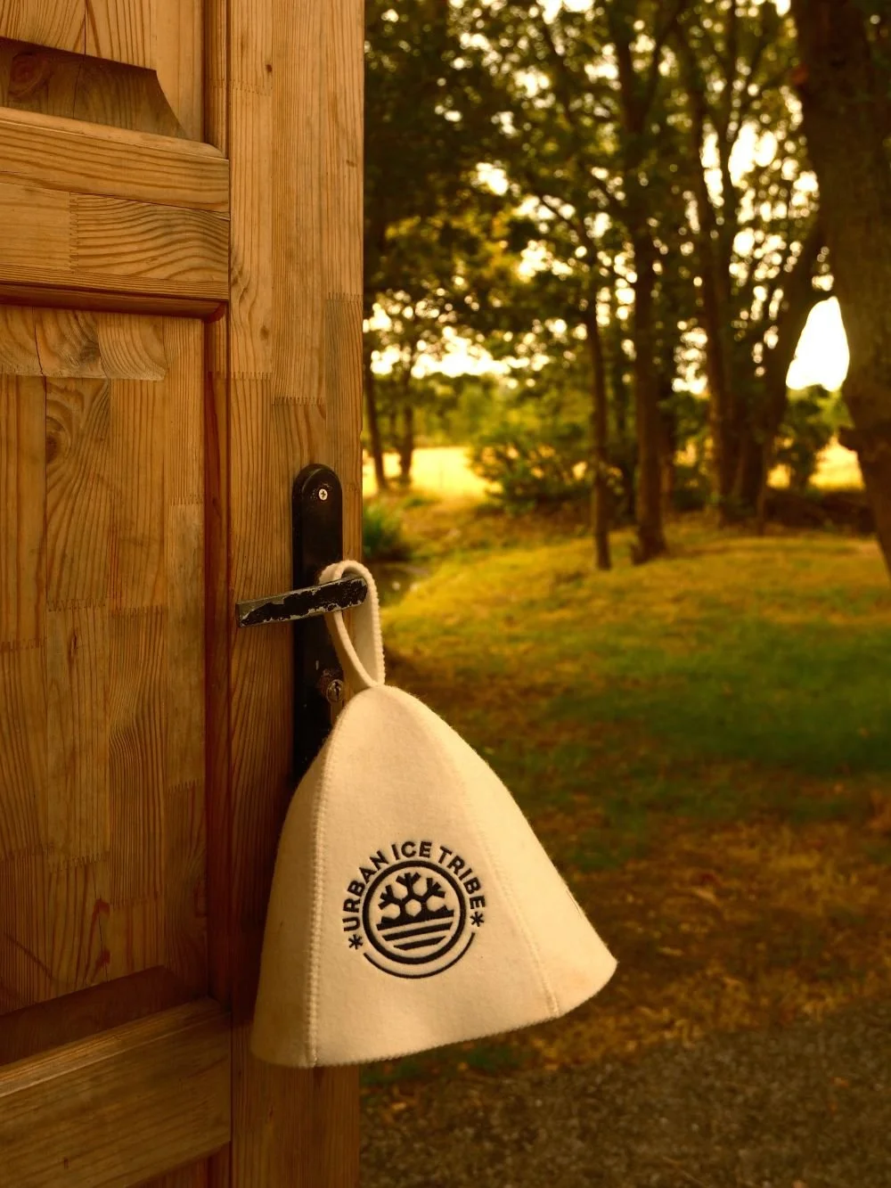 Sauna hat hanging on a sauna door handle