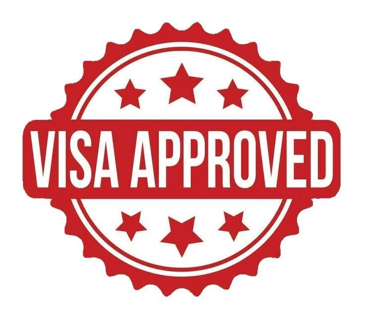 A badge with a red and white color scheme that reads 'VISA APPROVED' in bold letters, surrounded by stars.