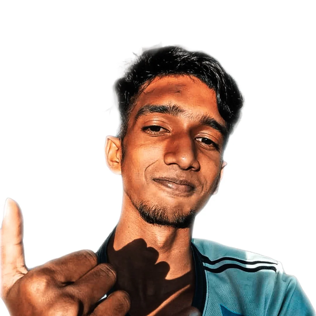 A young man making a finger gun gesture with his left hand, smiling subtly, with a bright white background.