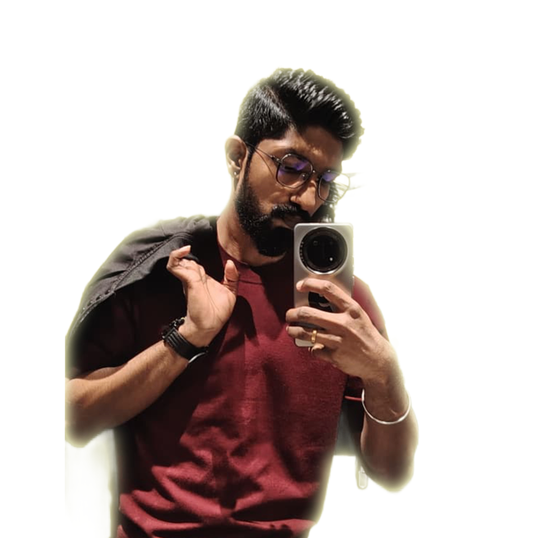 Man with glasses taking a mirror selfie, holding a jacket over his shoulder.