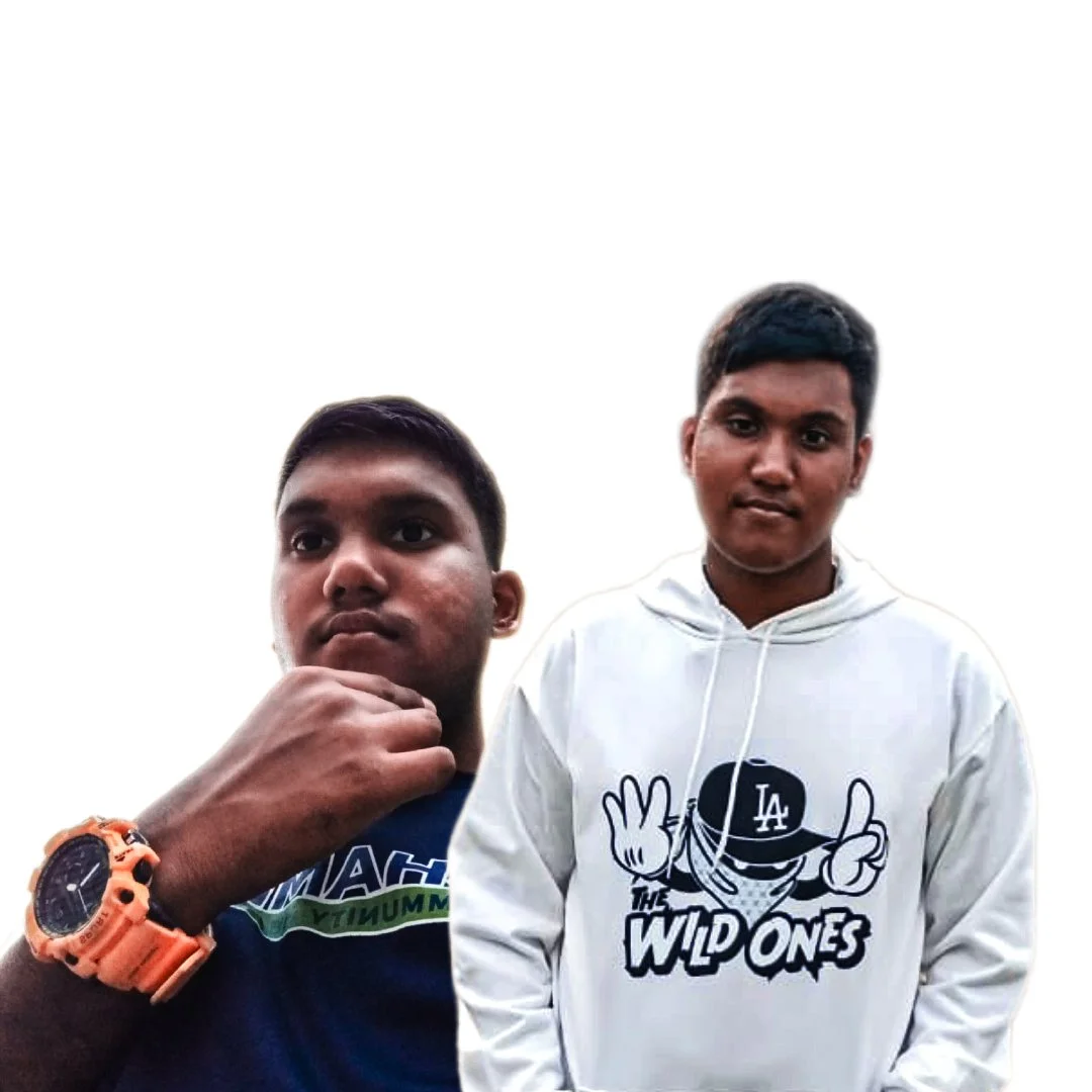 Two young men posing for a selfie against a plain white background, one in a blue traditional outfit and the other in an orange t-shirt.