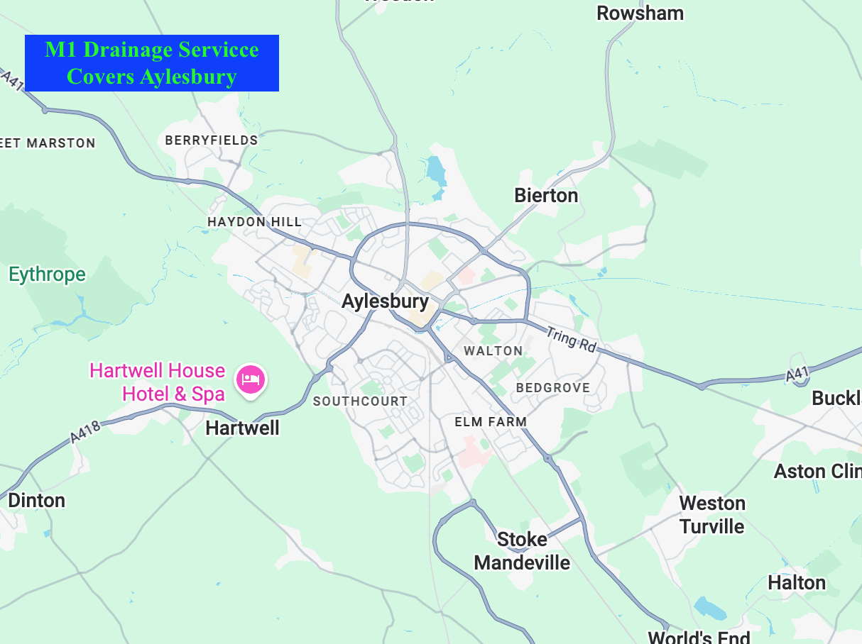Map showing Aylesbury and surrounding areas in England, highlighting the M1 Drainage Service covering Aylesbury, with a pink icon indicating the Hartwell House Hotel & Spa nearby.