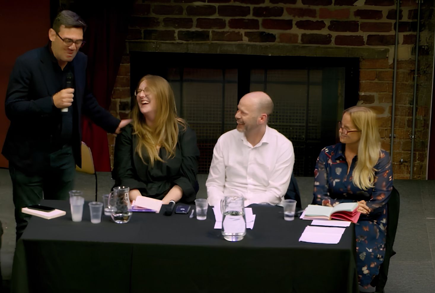 Cleo Goodman laughing with fellow panellists at The World Transformed festival, including Mayor of Greater Manchester Andy Burnham, North of Tyne Mayor Jamie Driscoll and Beth Winter MP.