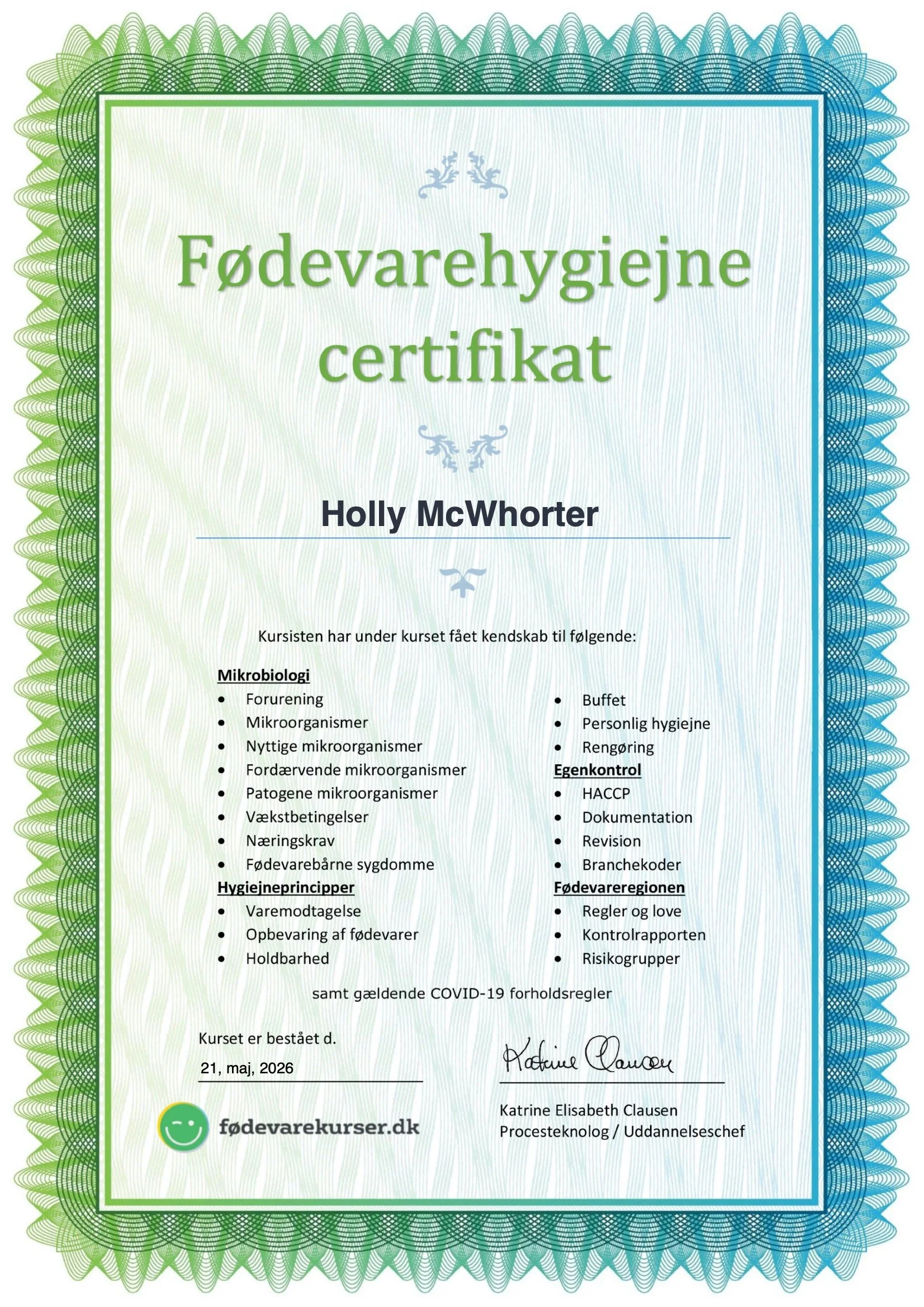 Food hygiene certificate with green and blue ornate border, issued to Holly McWhorter, signed and dated 21 May 2026, from fødevarekursus.dk.