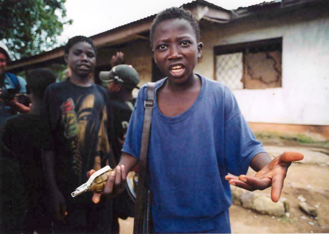 LURD rebels, a small boys unit in Voinjama, argue with Pelton. ©RYP, all rights reserved.