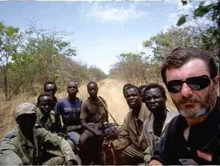 Robert Young Pelton and group of Sudanese rebels head to the front lines near Juba where Joseph Kony and Osama bin Laden's forces oppose the SPLA. ©RYP, all rights reserved