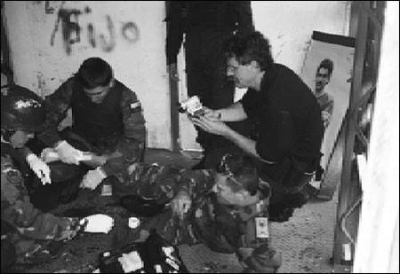 Robert Young Pelton records a live drill inside a Colombian kill house where the man in front him has been hit. ©Steve Salisbury,  all rights reserved