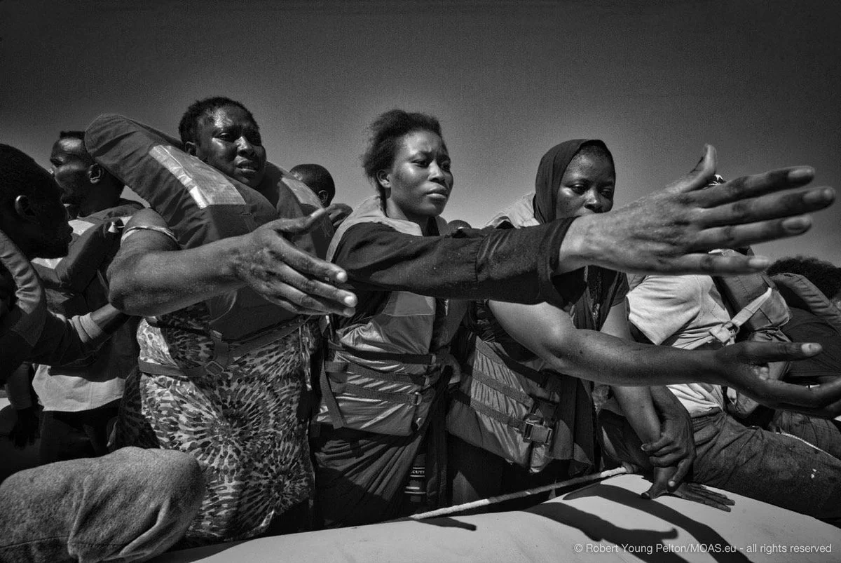 Nigerian migrants on a raft in the Mediterranean. ©Robert Young Pelton. all rights reserved. 
