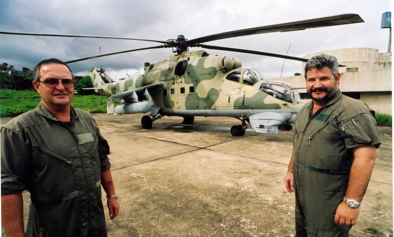 Neill Ellis and Kasi Nell in Sierra Leone flying the JESA Mi-24 gunship used in Operation Barras against the West Side Boys. ©Robert Young Pelton. all rights reserved. 