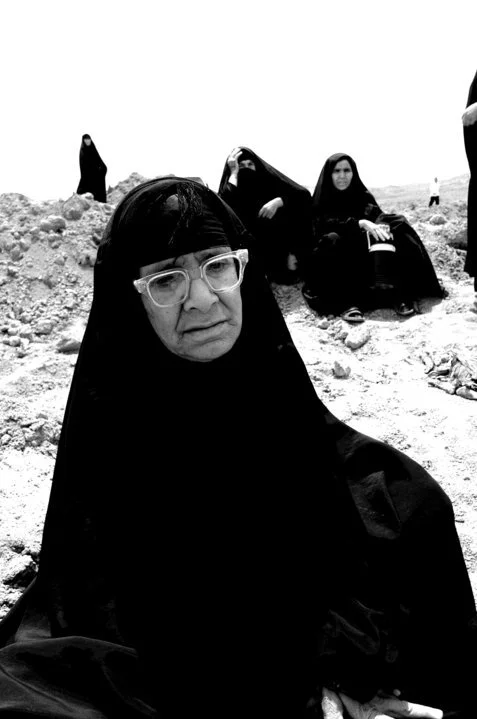 Shia women waiting for a mass grave to be exhumed outside Baghdad, Iraq.  ©Robert Young Pelton, all rights reserved. 