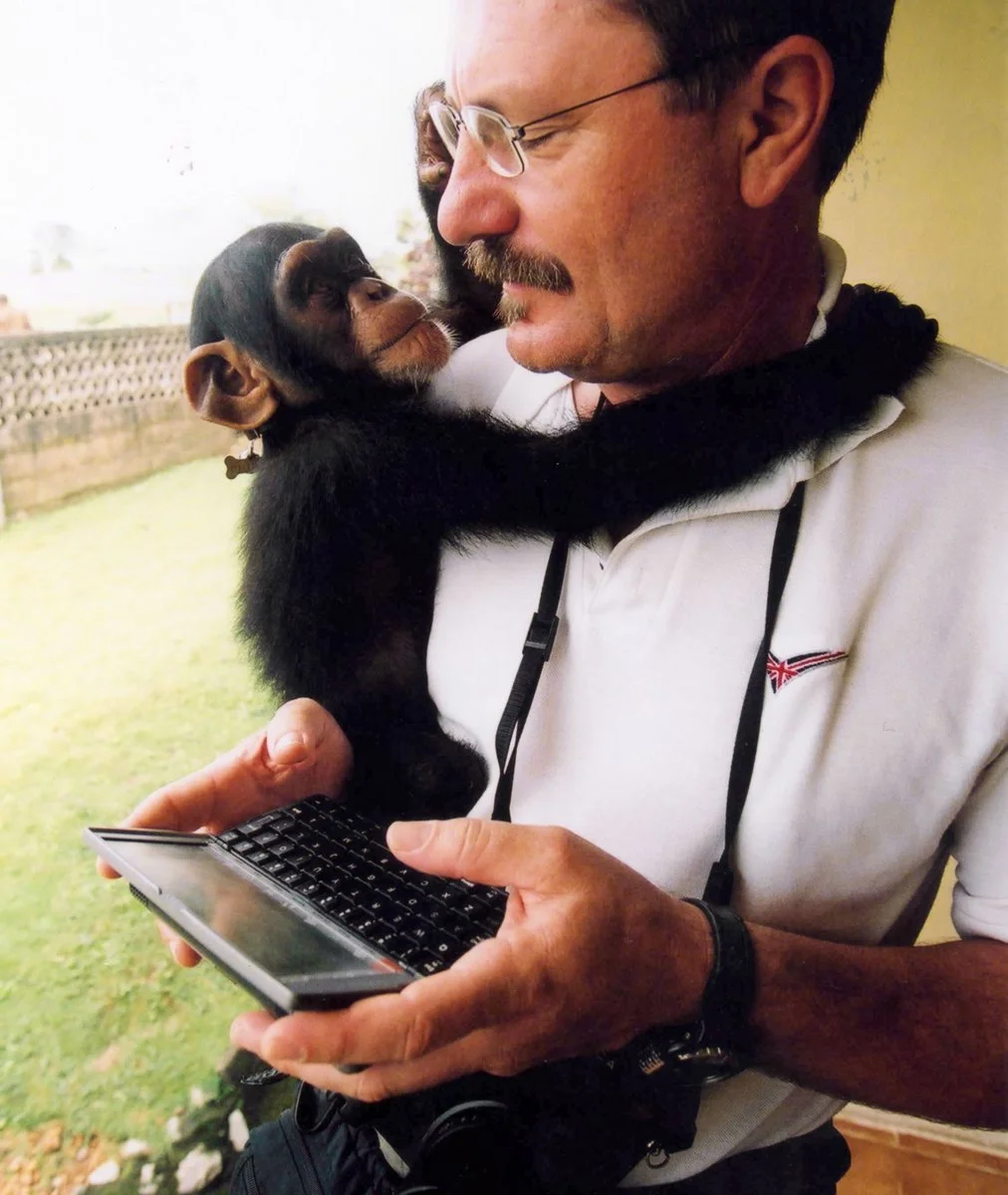 Robert Young Pelton with a young chimpanzee adopted by South African mercenaries in Sierra Leone. ©RYP, all rights reserved 