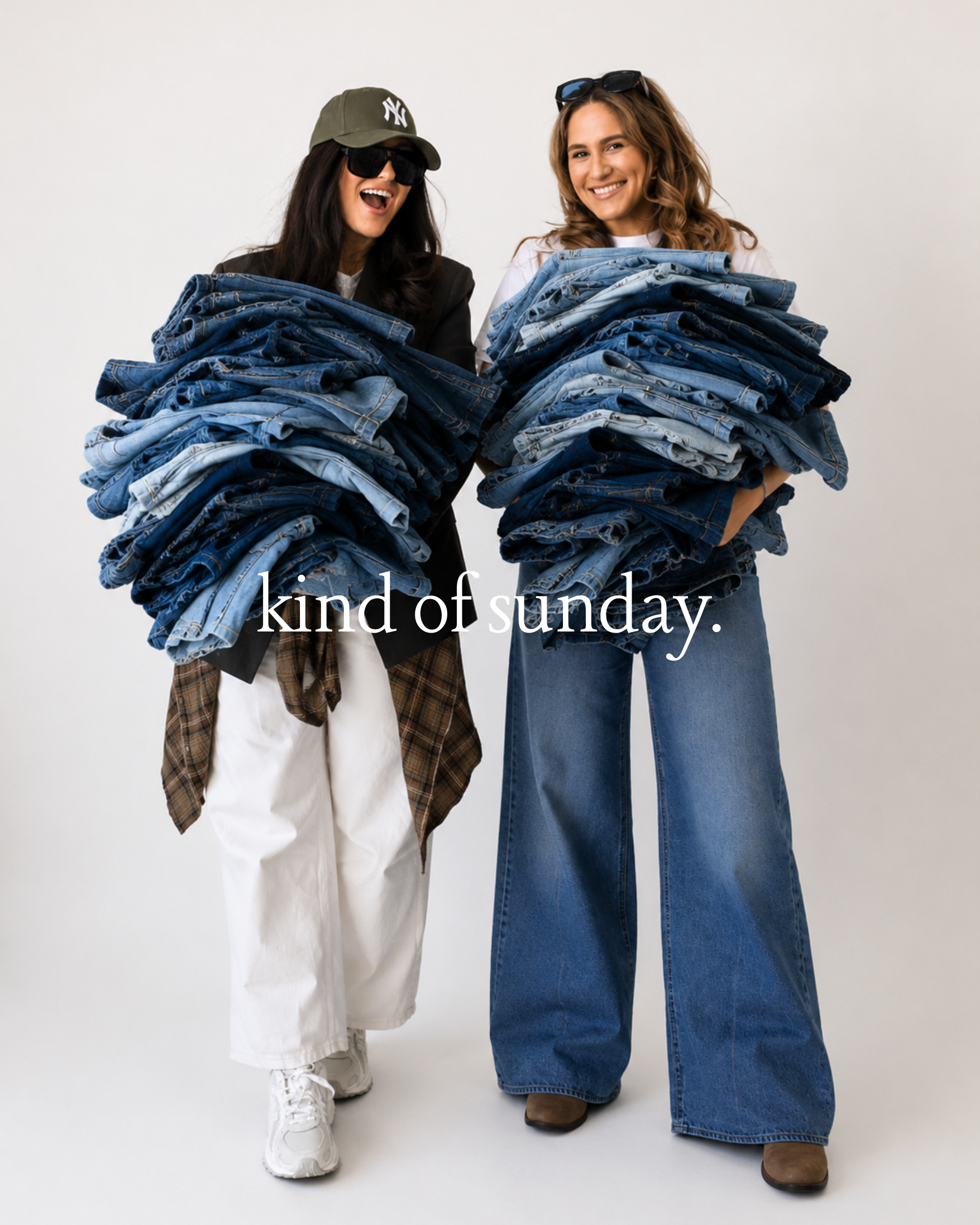 Two women smiling and holding large stacks of jeans, with the text "kind of sunday" overlayed on the image.