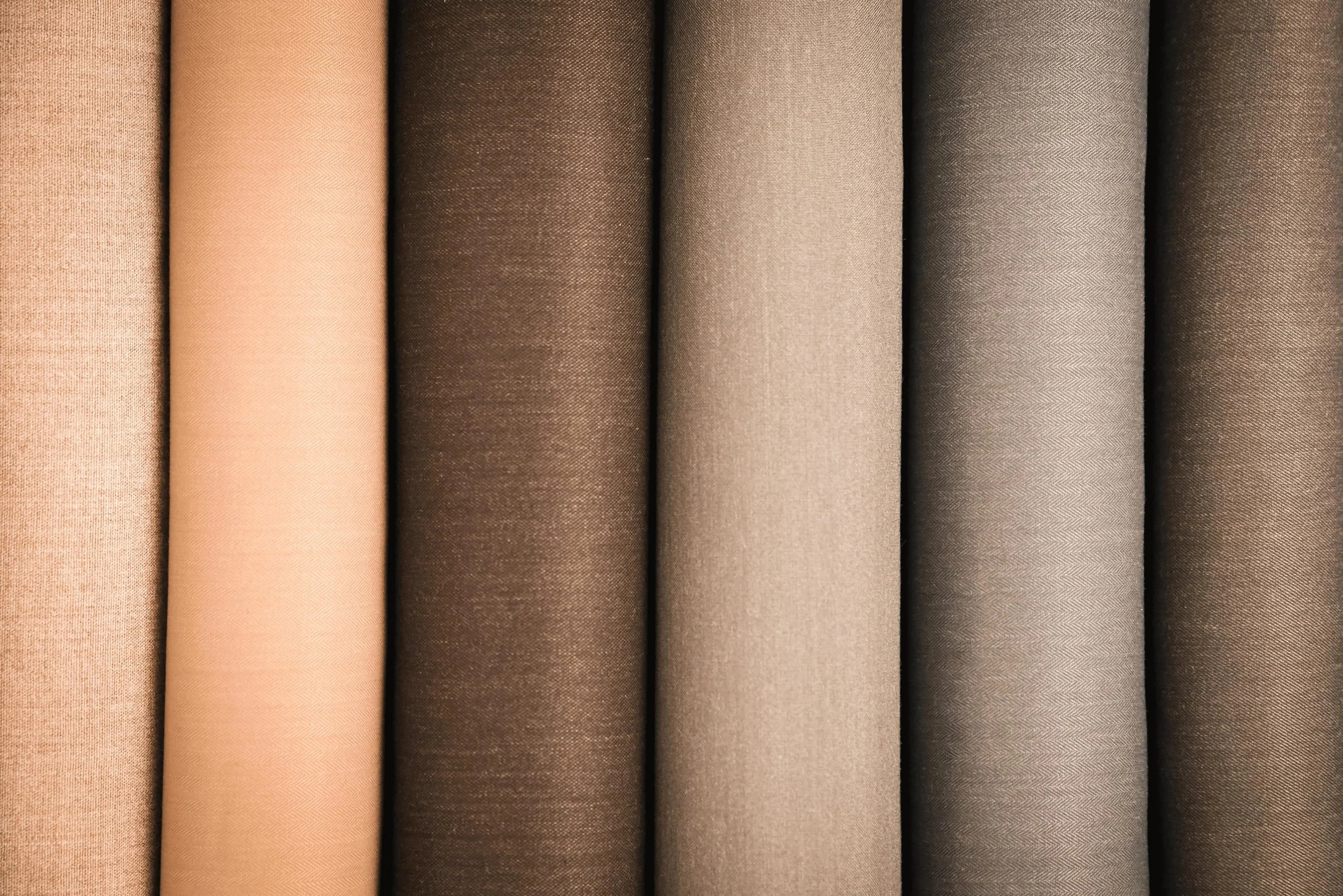 Selection of fabric rolls in neutral colours