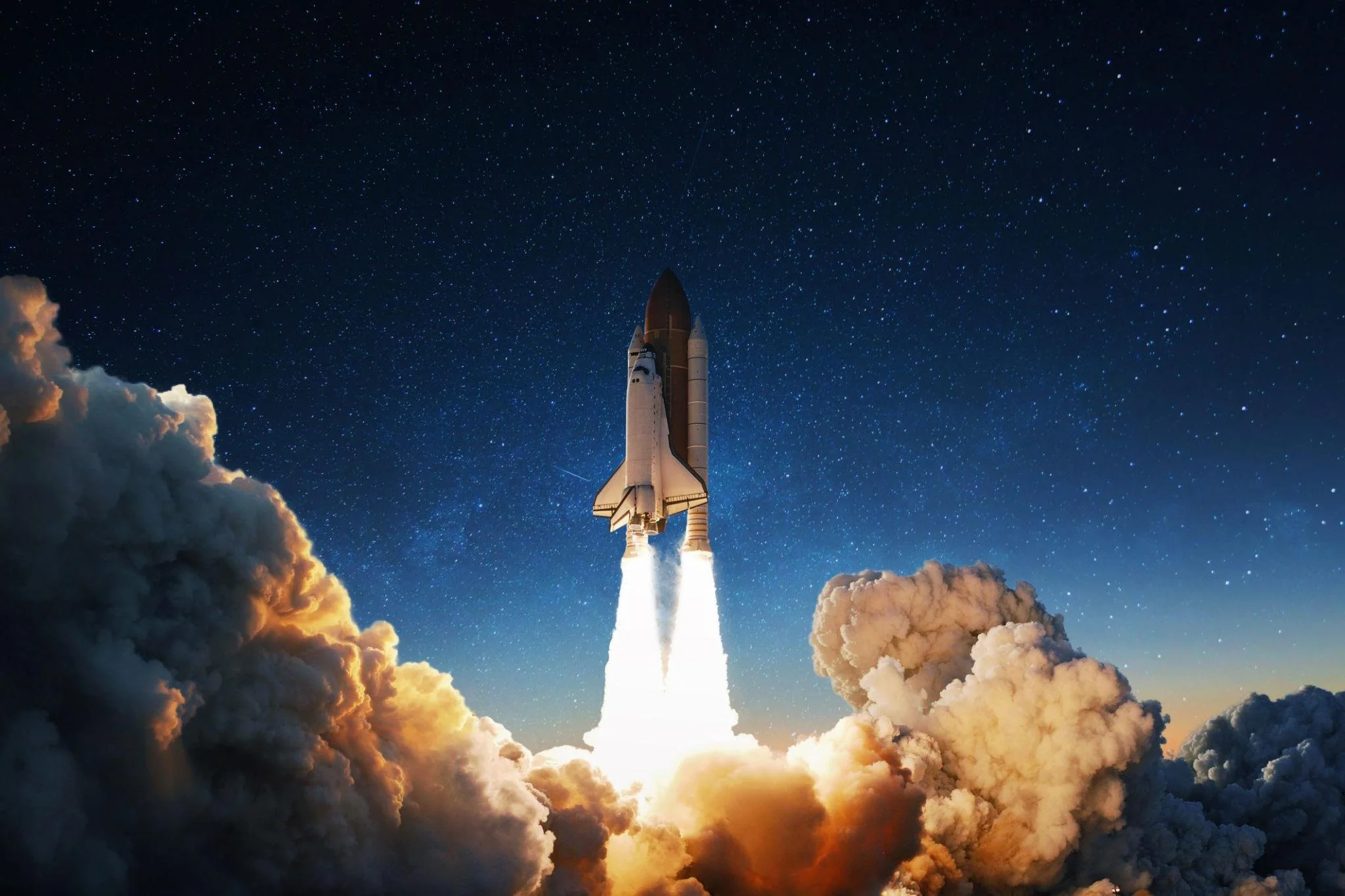 A space shuttle launching into space surrounded by billowing clouds of smoke and fire with a starry night sky in the background.