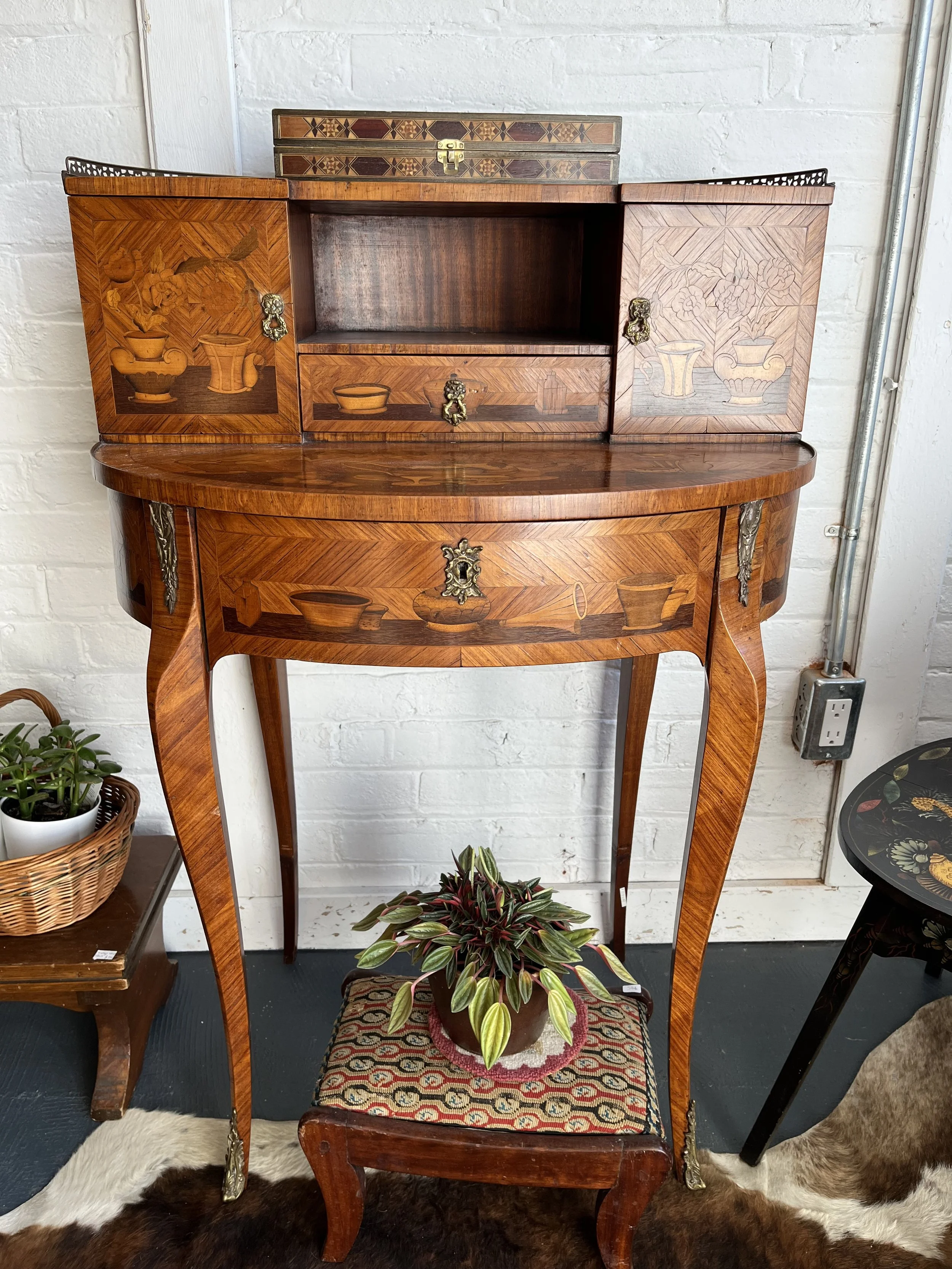 Early 1900s "Bonheur du jour" writing desk with impressive marquetry on all sides of the piece. 26 x 38 x 19" 
($425)