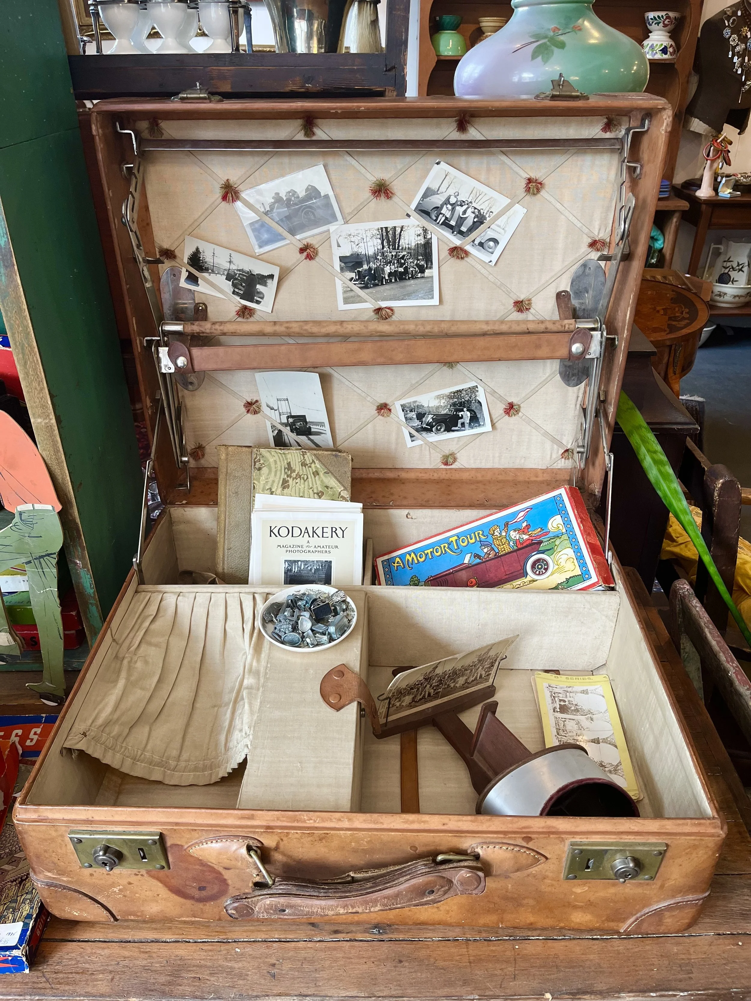 Leather suitcase with interesting interior- high quality- tufted back insert.  ($195)