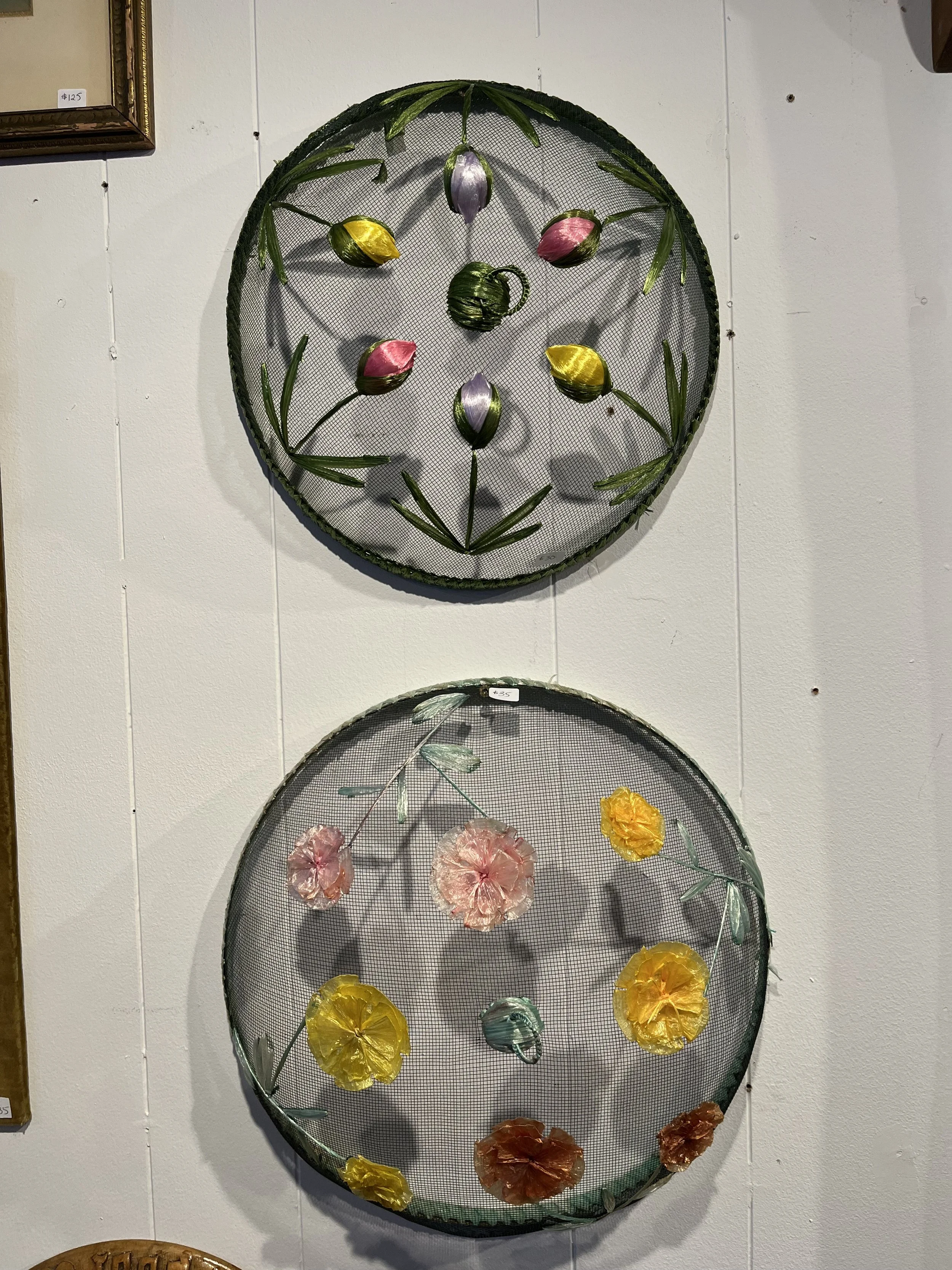 Two mid century food domes.  Floral accents  Largest measures 14" diameter.  SOLD